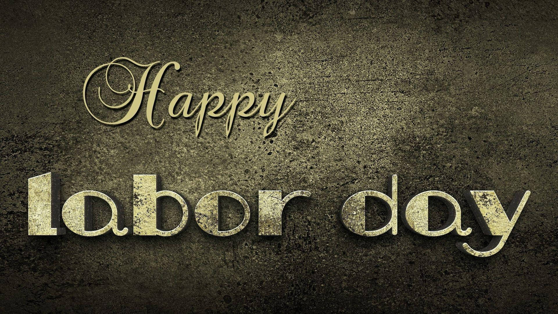 粗糙混凝土牆上金色Happy Labor Day文字。