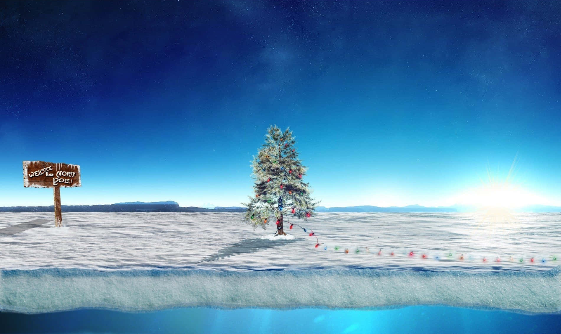 在星空下的雪地裡，一棵裝飾好的聖誕樹和一個歡迎標誌。