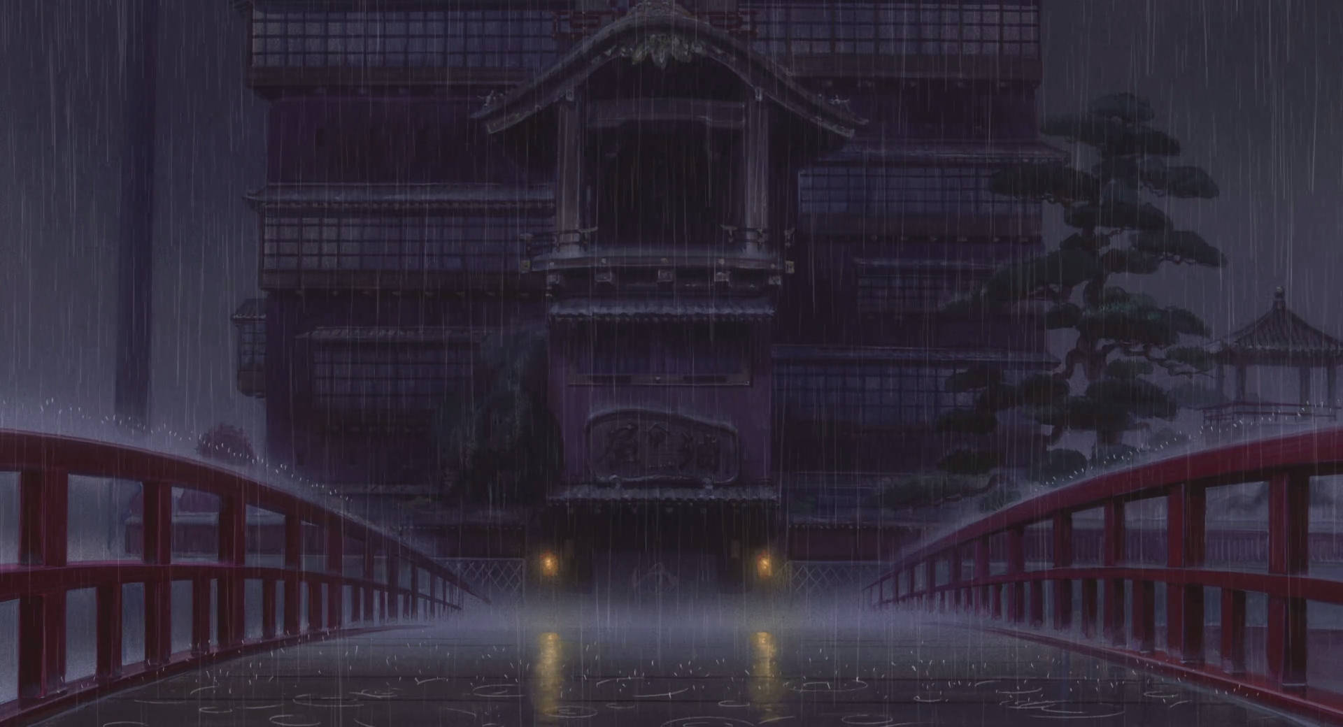 雨中的紅色橋樑，夜晚通往傳統日本建築。