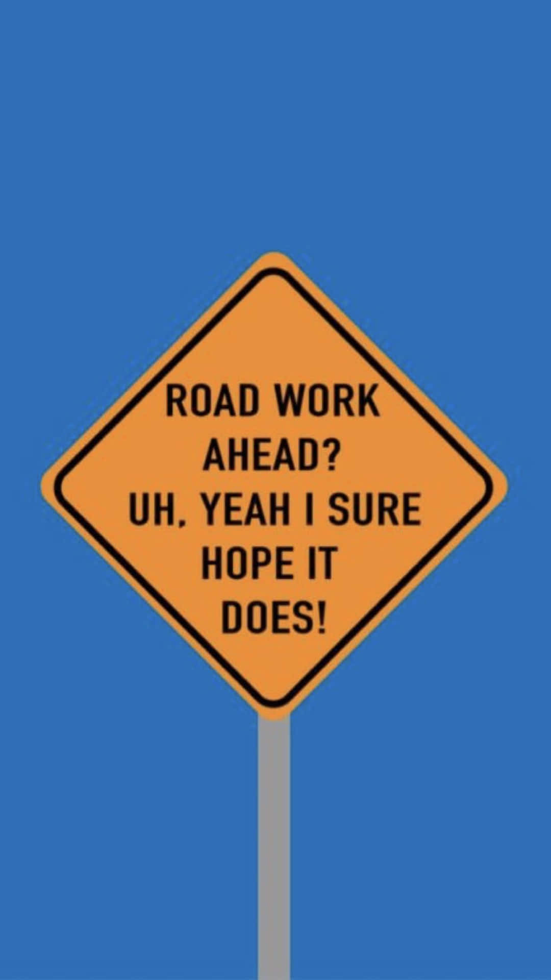 一個黃色菱形道路工程標誌，帶有諷刺文字：「前面有道路工程？嗯，是的，我當然希望如此！」