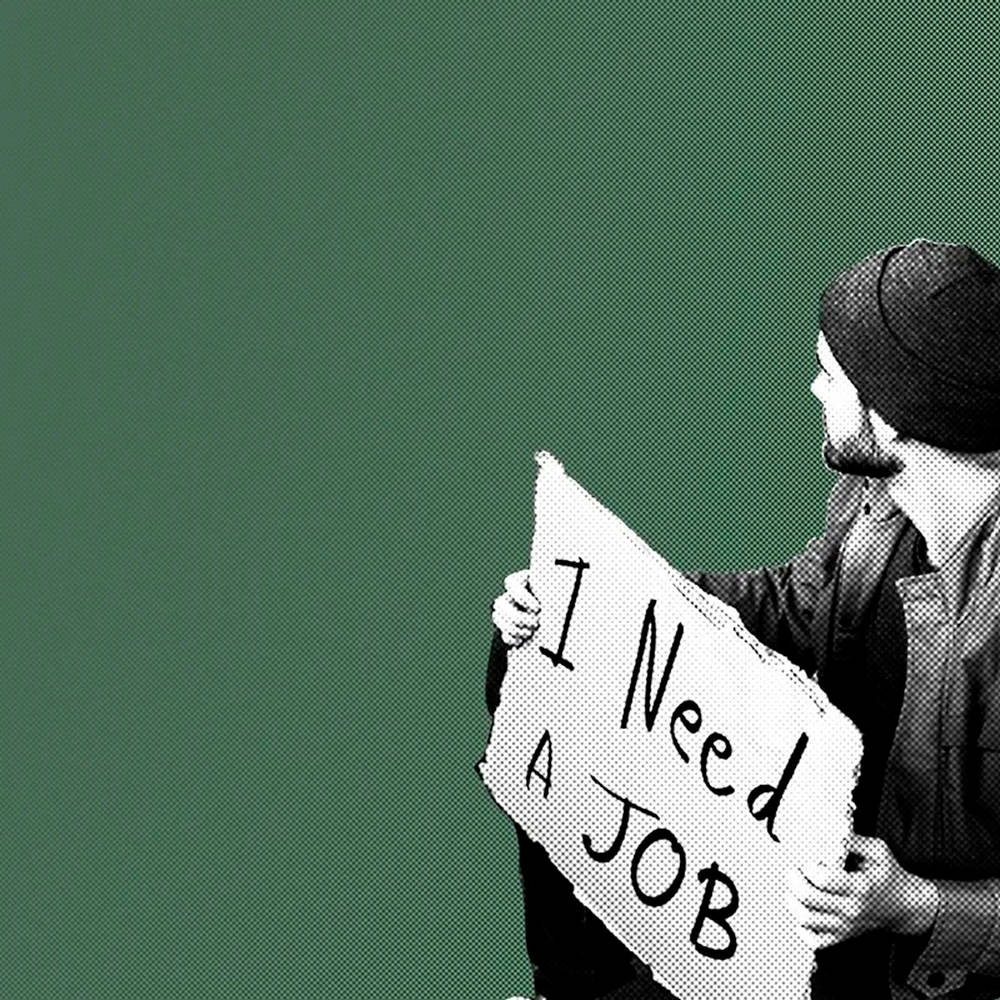 手持寫有 I Need A JOB 標語牌的人