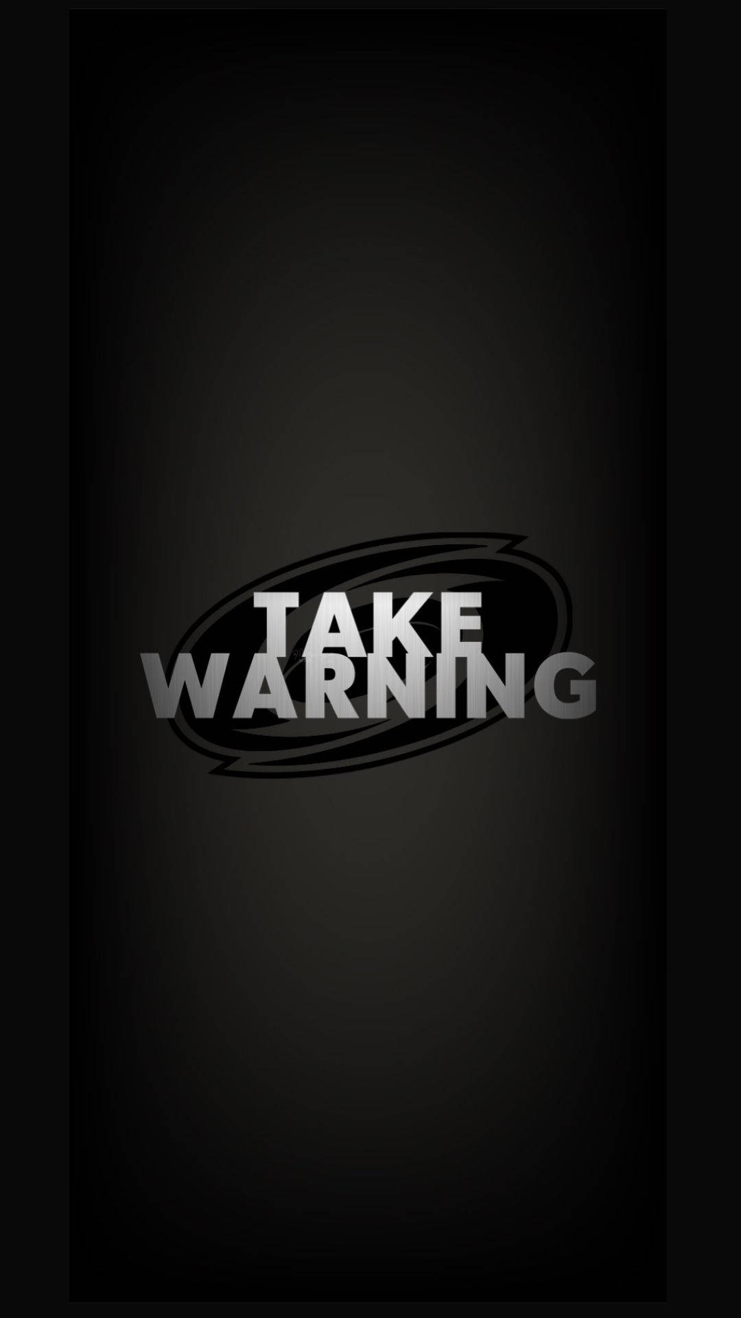 卡羅萊納海鷗隊警告語 壁紙 — 粗體白色文字寫著「TAKE WARNING」，置中在深色漸變背景上，帶有風格化的橢圓形輪廓。