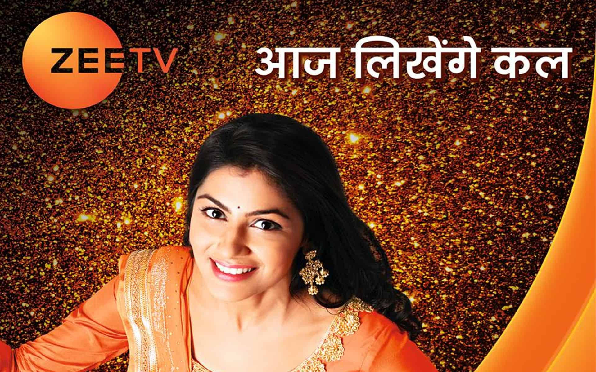 穿著橙色紗麗的女性在閃爍的金色背景前微笑，帶有Zeetv標誌。