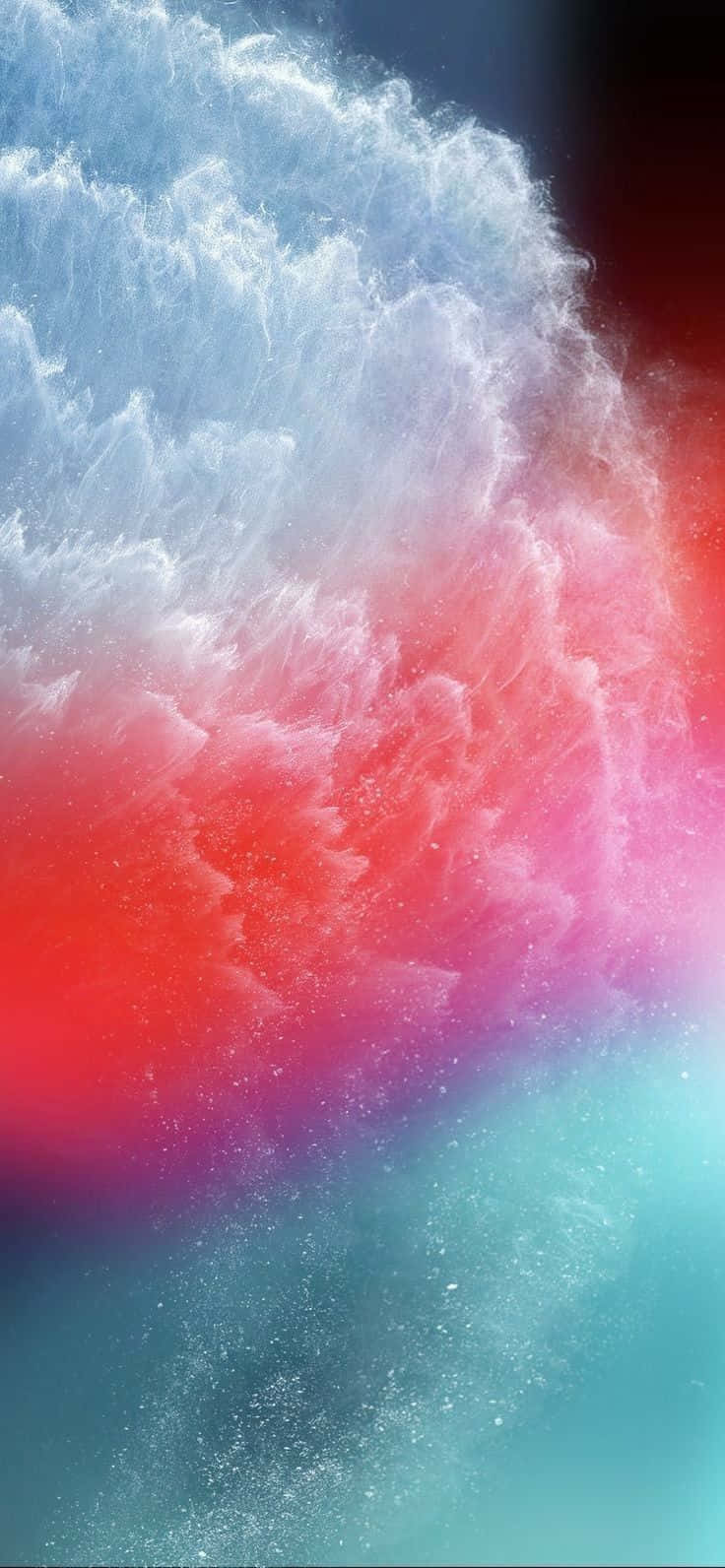 原版 iPhone 5s 星空美學壁紙 壁紙 — 鮮紅色、粉紅色和藍綠色的宇宙塵埃在充滿活力的抽象宇宙場景中旋轉，形成動態爆炸。