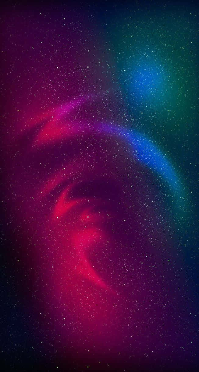 色彩繽紛的宇宙星雲，帶有旋轉的洋紅色和藍綠色雲層及星星。 — 粉紅色 iPhone 壁紙