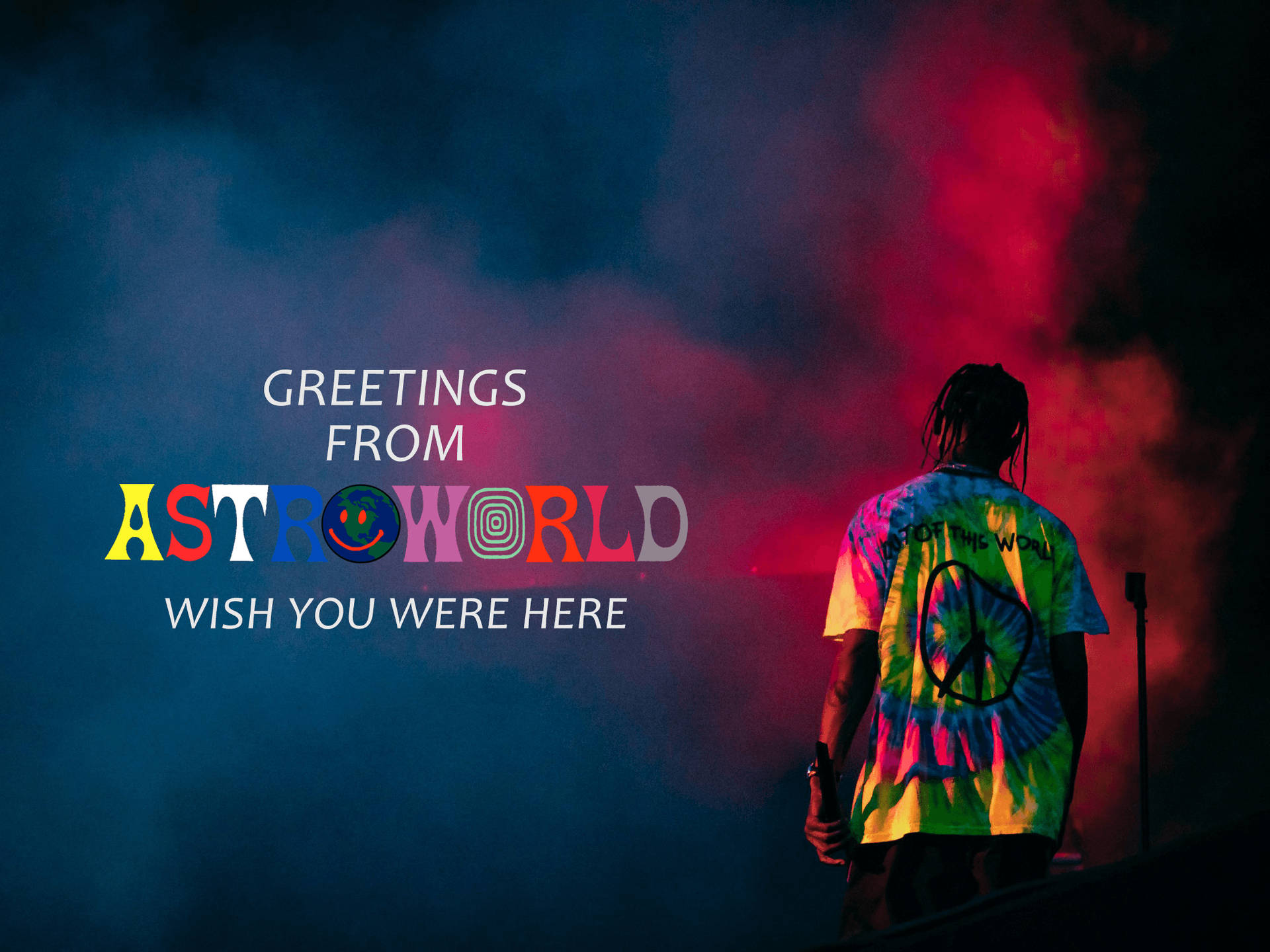 穿著紮染襯衫的人在 Astroworld 音樂會舞台上，伴隨著彩色煙霧和文字。