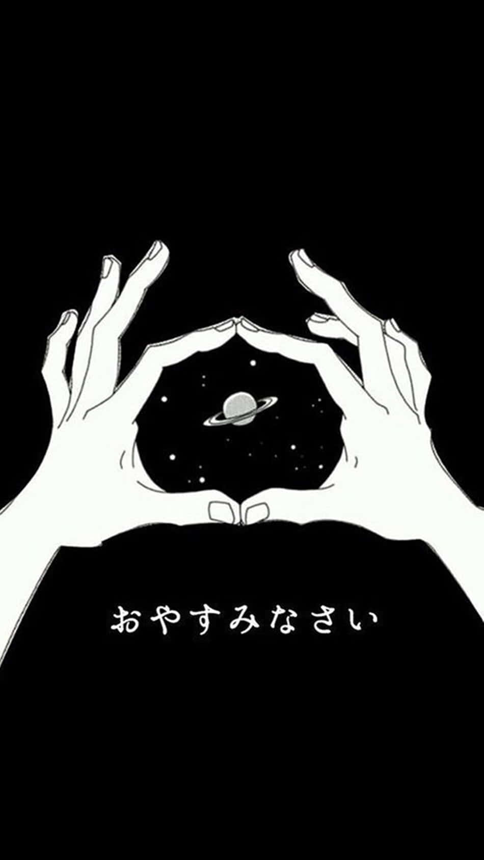 手在帶有光環和星星的行星周圍形成心形。