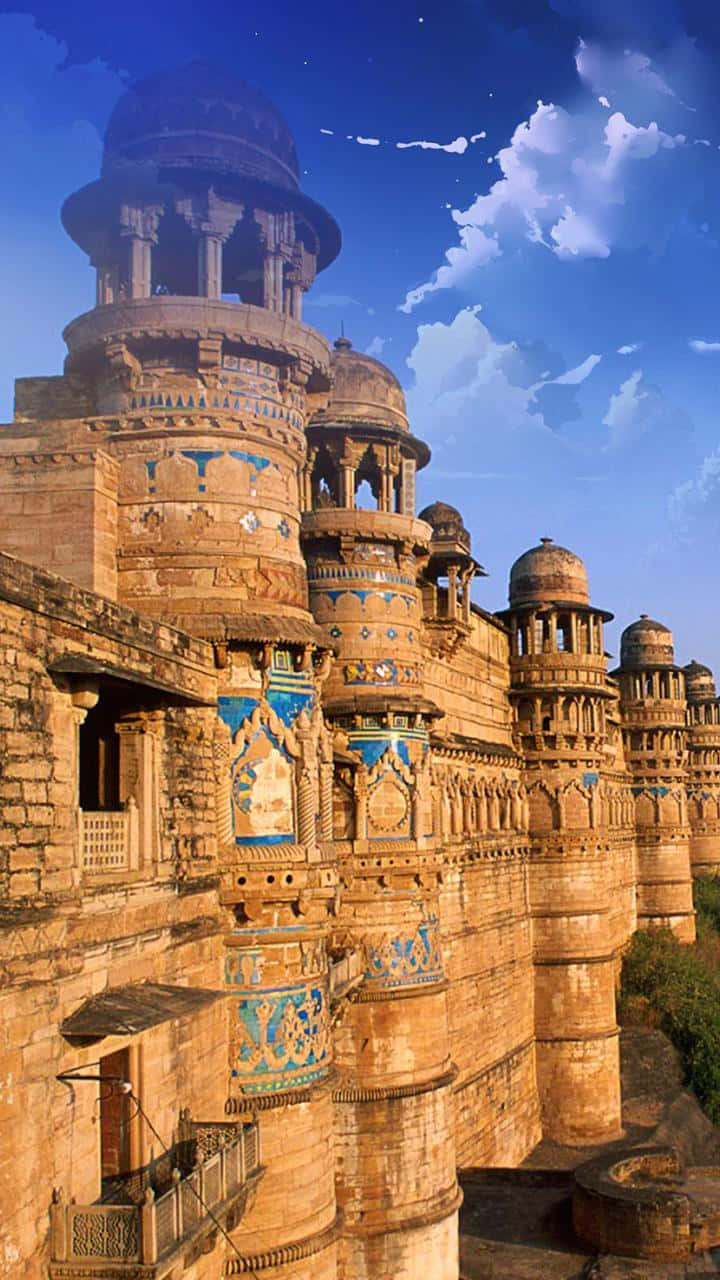 Rajasthan 桌布 壁紙 — 古老石堡，圓頂塔樓，藍色瓷磚壁畫，在明亮的藍天和蓬鬆的雲朵下。