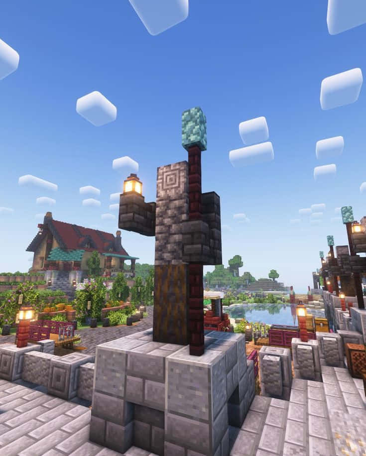 召集夥伴！ 壁紙 — 一個Minecraft村莊，有鵝卵石小路、發光的燈籠和鑽石方塊塔，背景是晴朗的藍天和方塊狀雲朵。