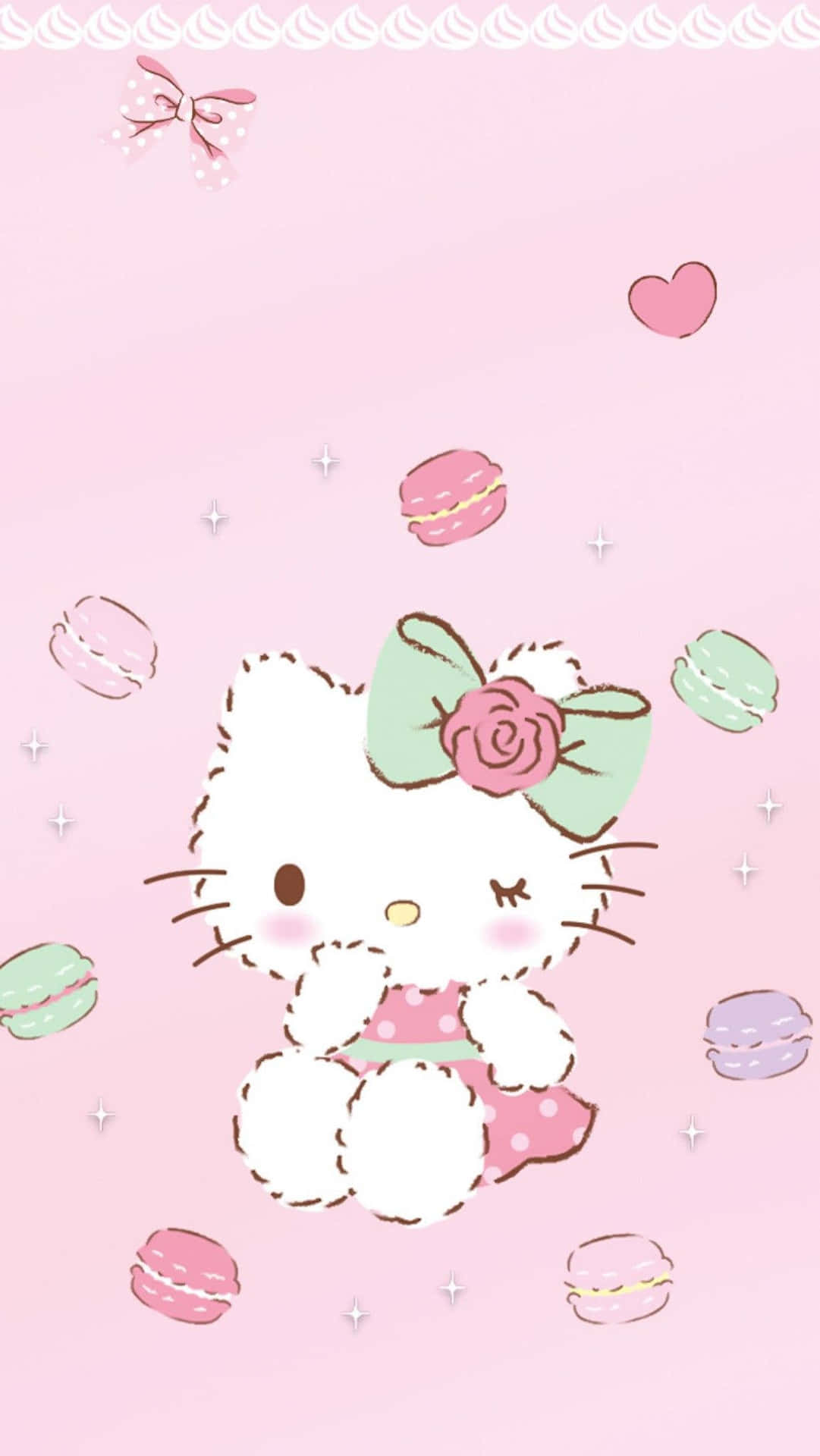 Hello Kitty 被馬卡龍和心形圖案包圍在粉紅色背景上