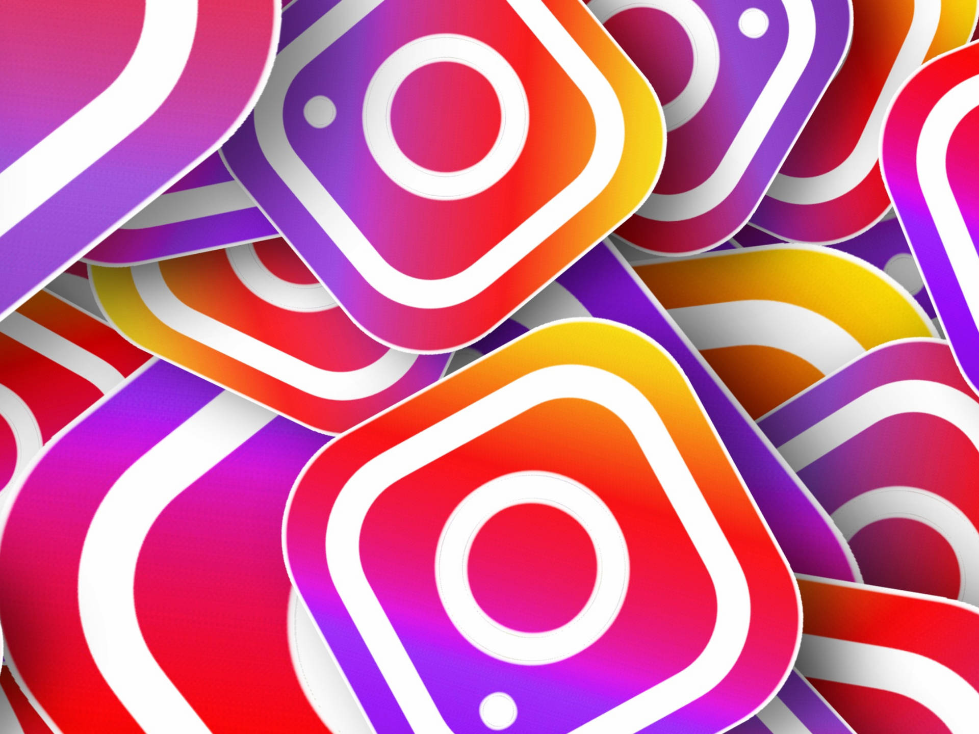 可愛 Instagram 標誌貼紙 壁紙 — 充滿活力的漸變Instagram應用程式圖示重疊，形成動態多彩的數位圖案。