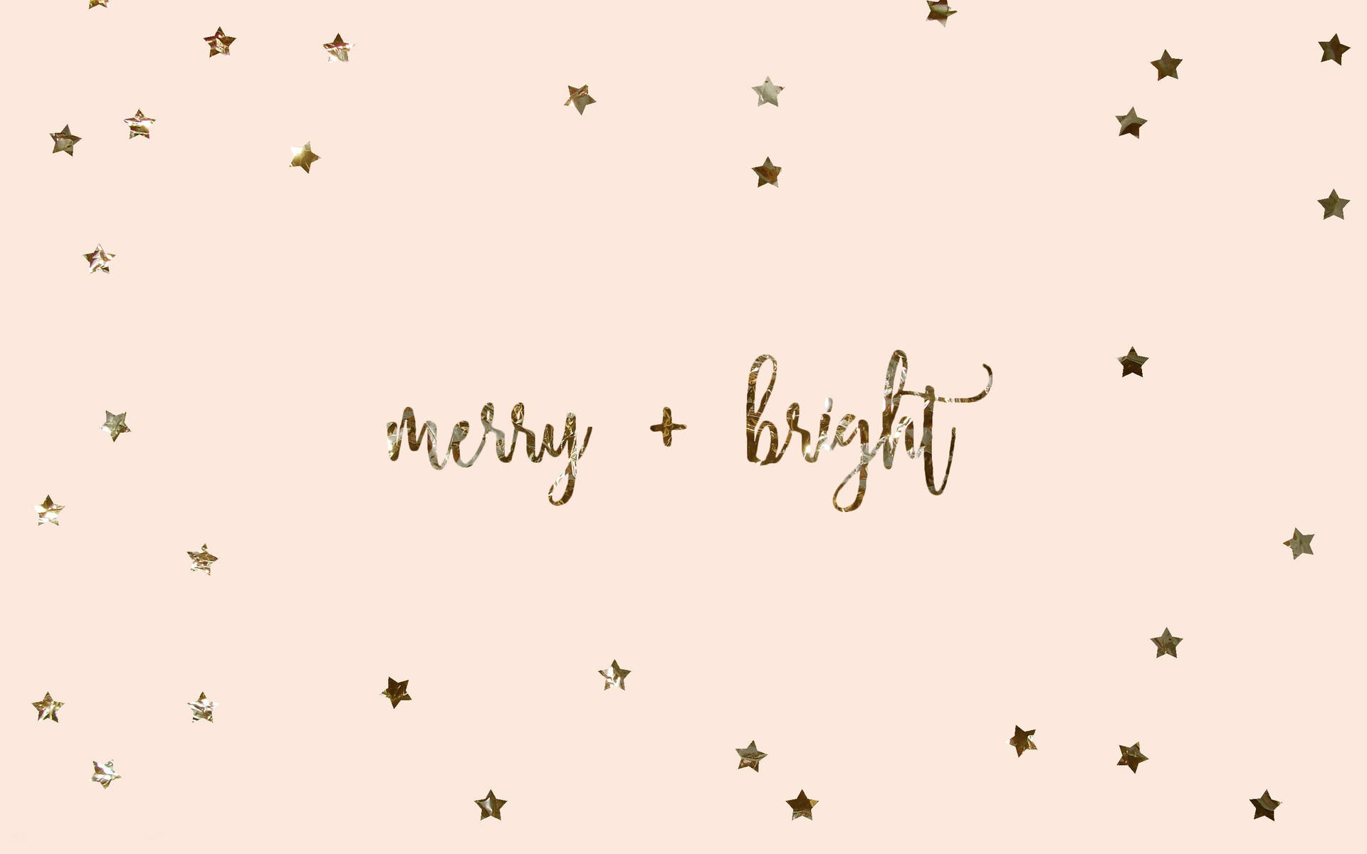 胭脂色背景上散落著金色星星和閃爍的「merry bright」文字。