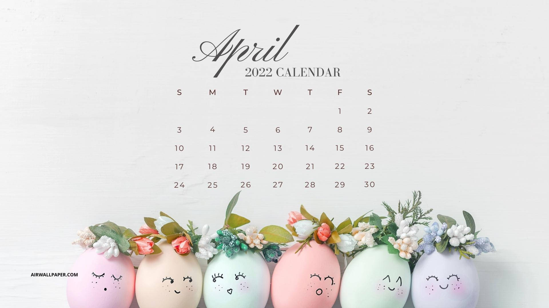 2022年4月日曆，帶有微笑的柔和蛋，以花朵裝飾。