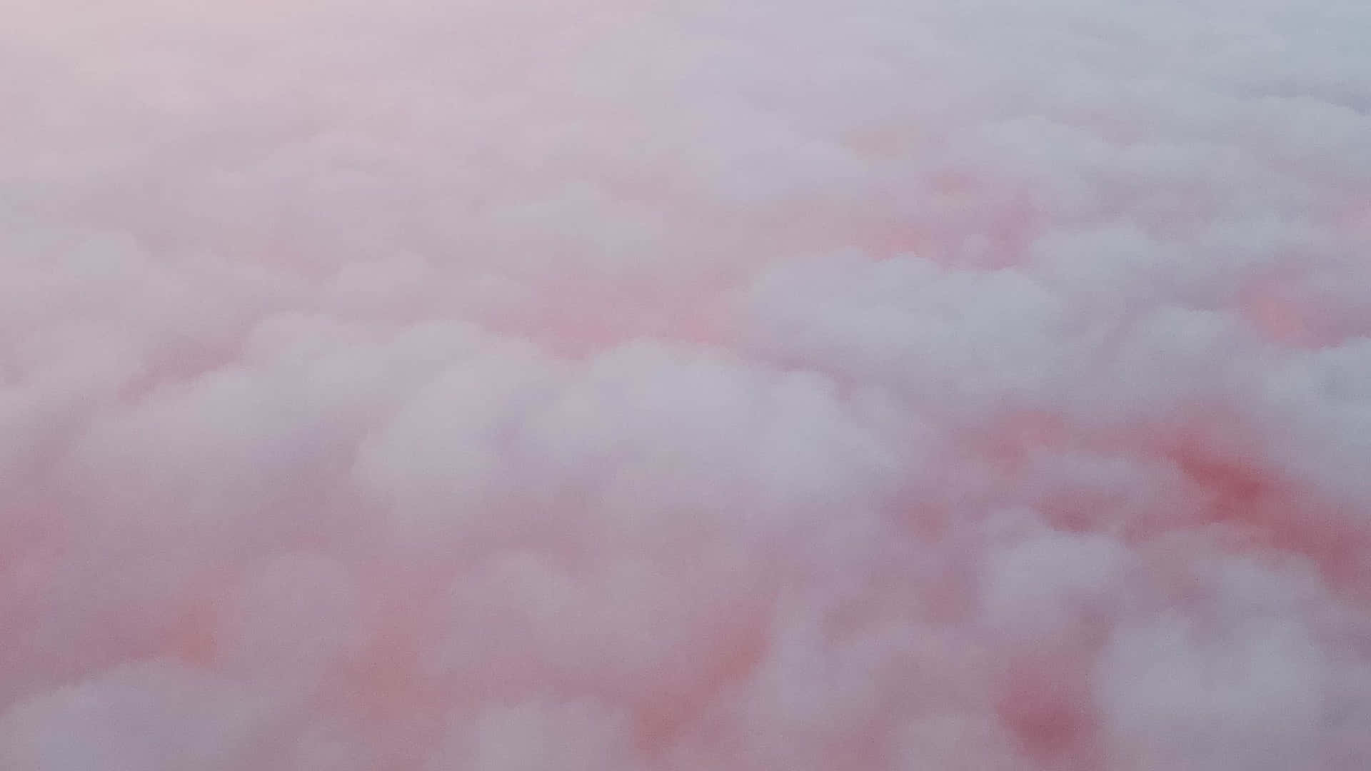 粉紅色和白色雲朵在寧靜的天空中飄浮，帶有柔和的漸變。