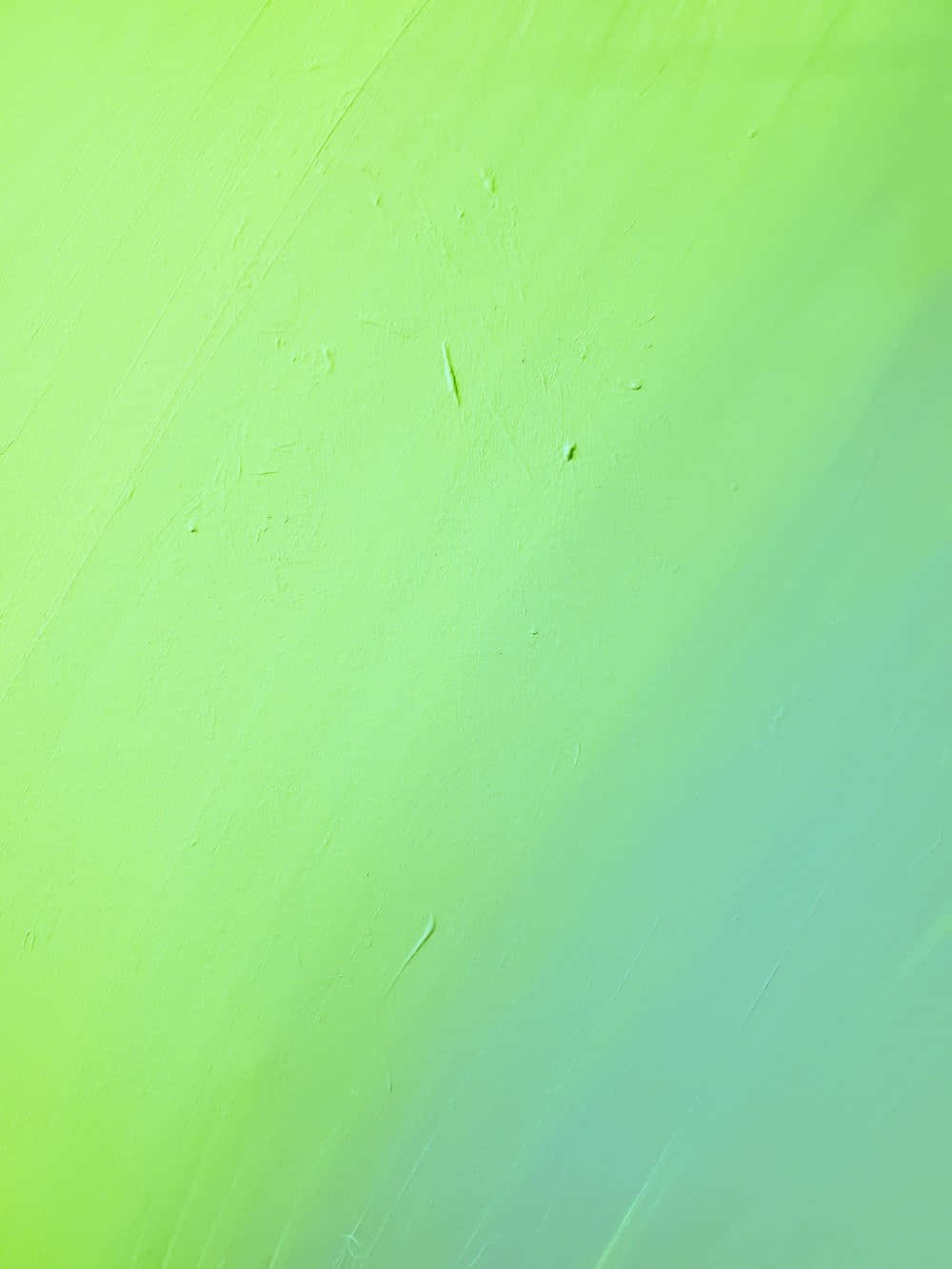 可愛淡綠斜向漸層 壁紙 — 從青檸綠到藍綠色的鮮豔漸變，表面帶有細微的筆觸和紋理。