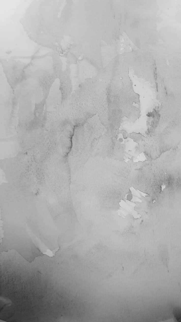紋理紙張上帶有機顏料滲色的抽象灰階水彩紋理。
