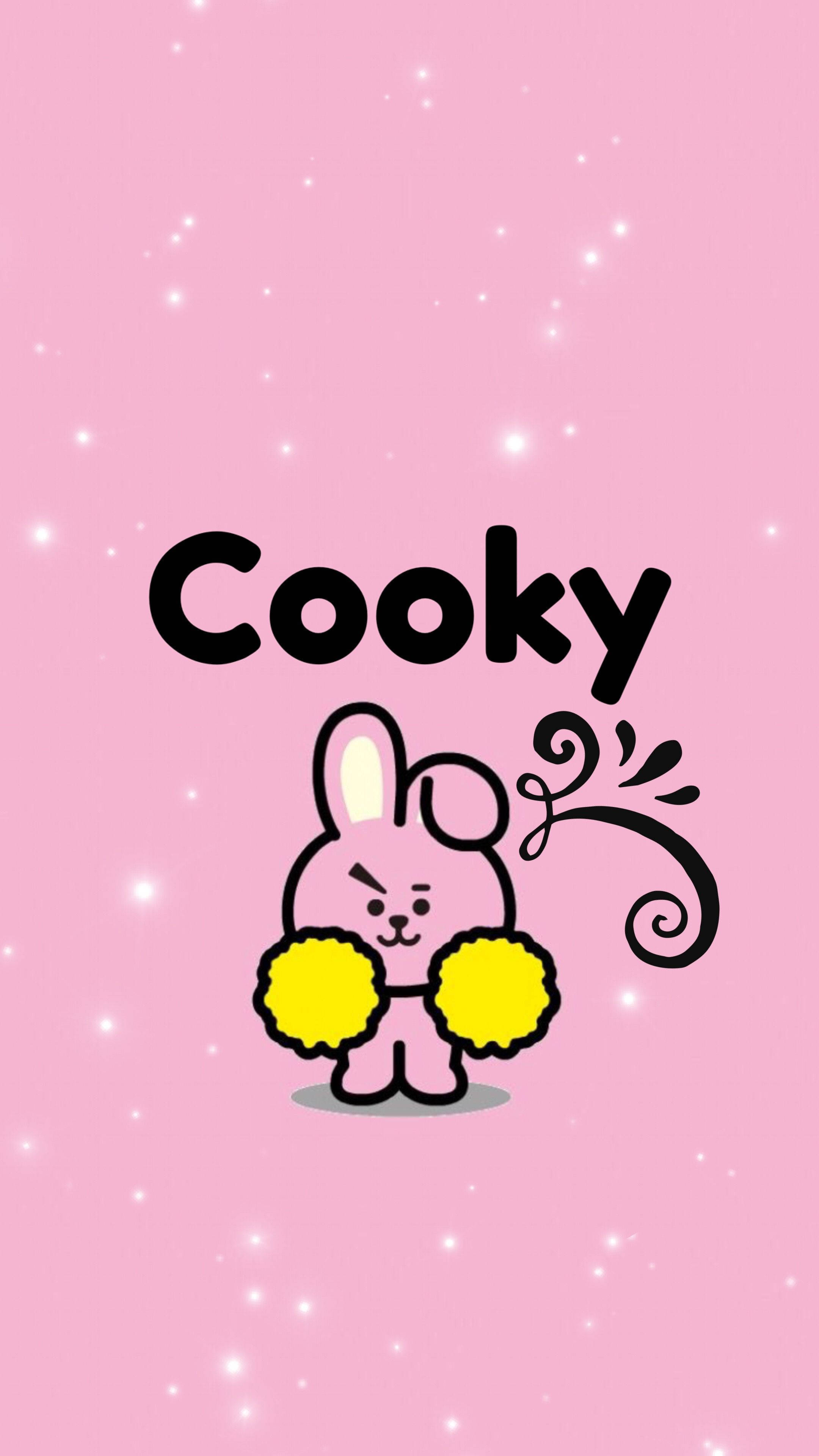 可愛的 Cooky BT21 展現強勁又萌樣 壁紙 — 一隻名叫Cooky的可愛粉紅色卡通兔仔在閃閃發光的粉紅色背景前拿著黃色絨球。