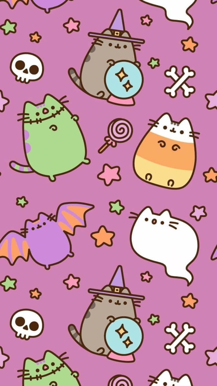 Pusheen 桌布 壁紙 — 可愛的卡通貓咪打扮成女巫、蝙蝠和糖果玉米，在粉紅色背景上漂浮在星星、骷髏和骨頭之間。