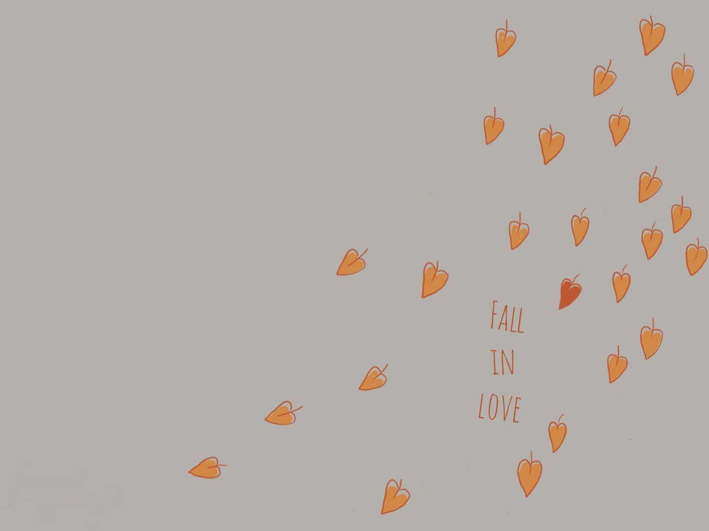橙色心形對角飄浮，灰色背景上寫有「fall in love」。