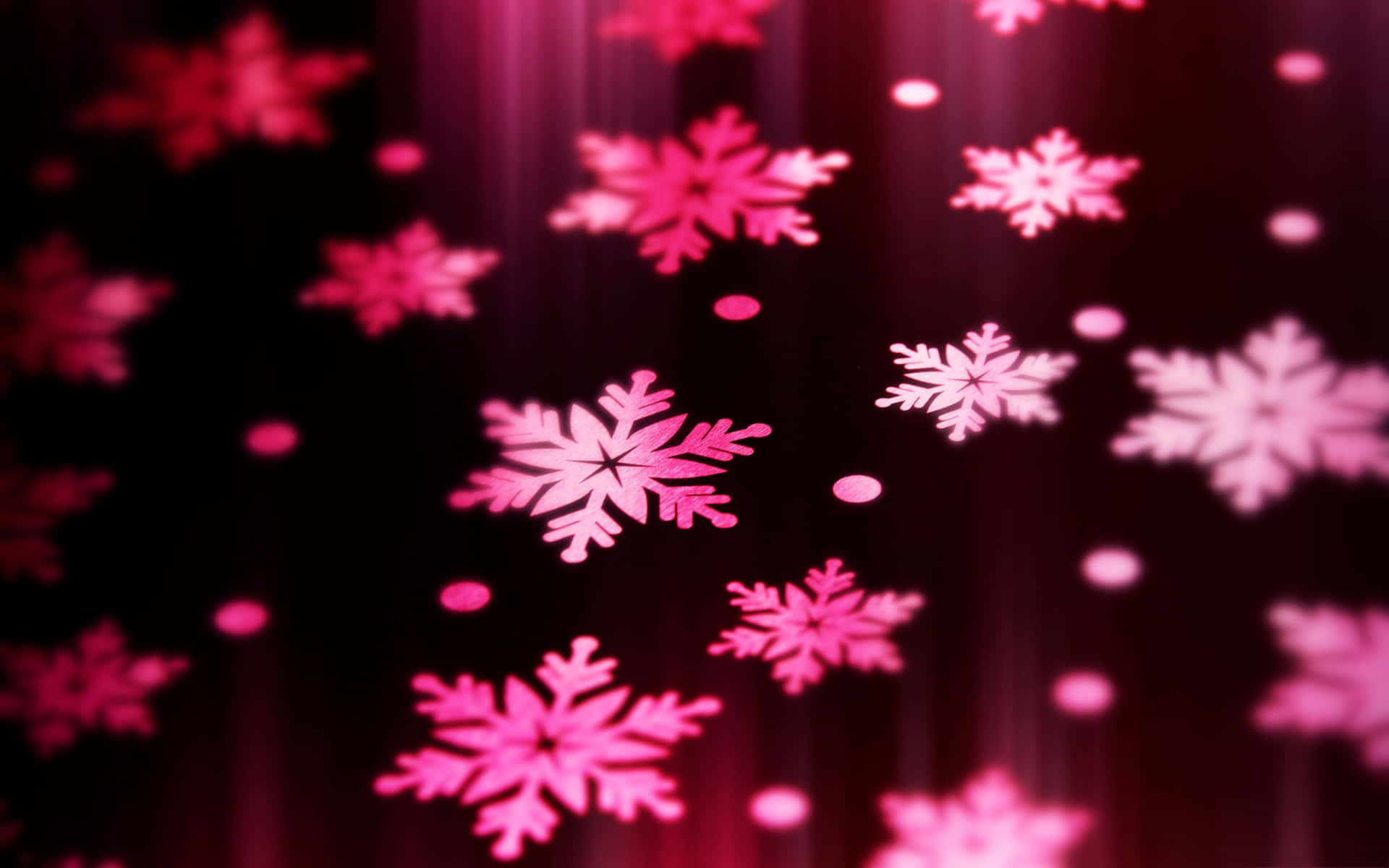 粉紅色雪花在黑暗背景上發光，帶有光線條。