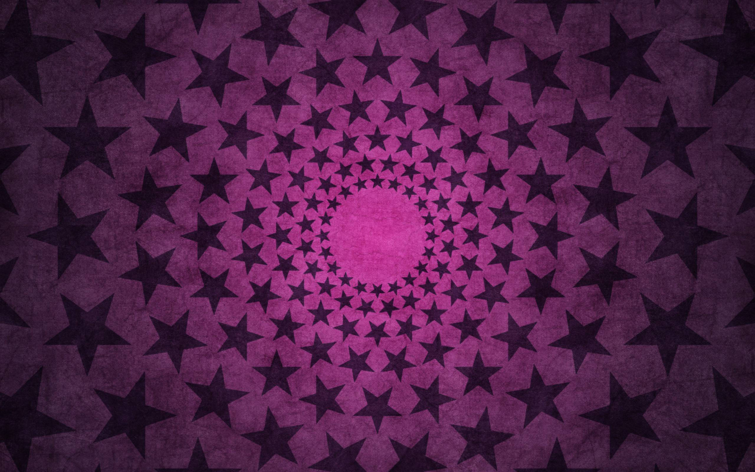 可愛粉紅螺旋星圖壁紙 壁紙 — 一個催眠般的黑暗星星螺旋從發光的粉紅色中心向帶有紋理的紫色背景輻射。