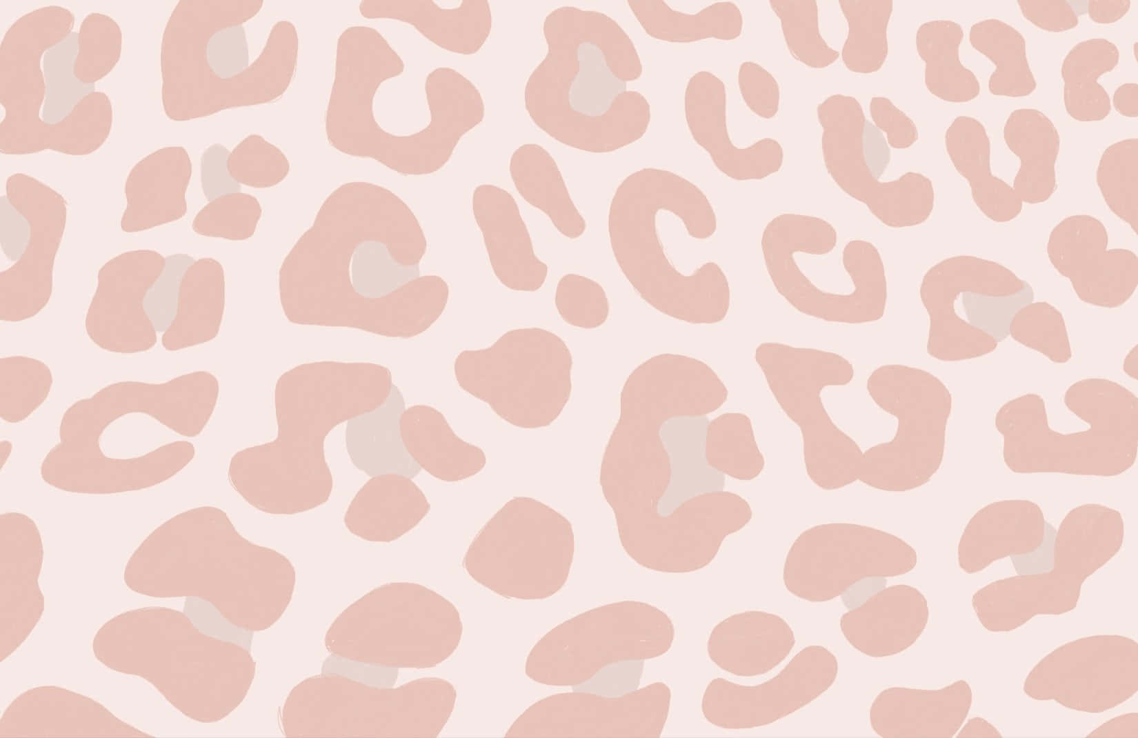 用於牆紙或紡織設計的粉紅與米色豹紋圖案。