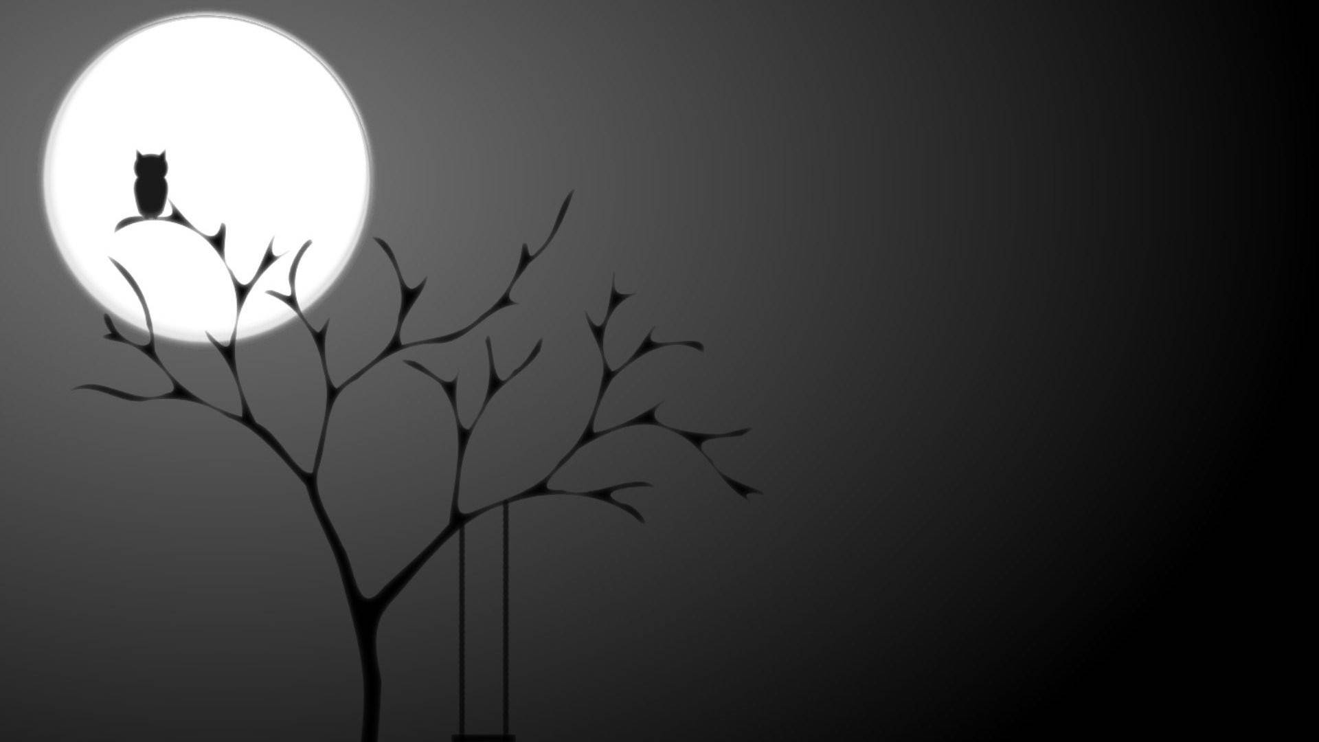 貓頭鷹在滿月之夜棲息在光禿禿的樹枝上
