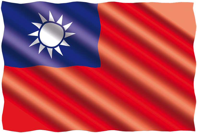 台灣國旗飄揚 壁紙 — 數碼渲染的台灣旗幟動態飄揚，帶有鮮明的紅色和藍色部分以及白色太陽標誌。