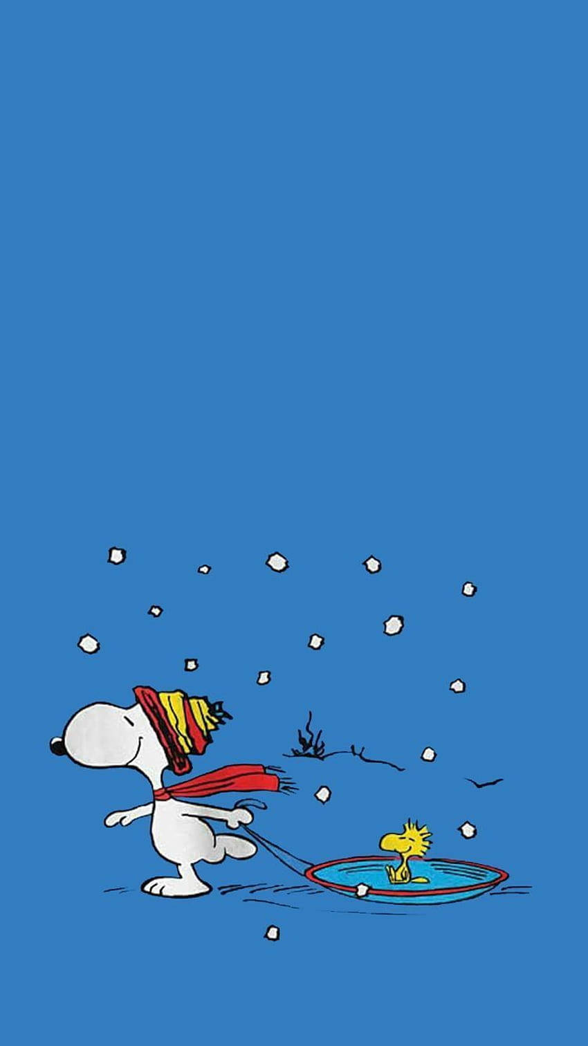 史努比拖住胡士托喺雪橇上，穿過雪花。 — 簡約 壁紙