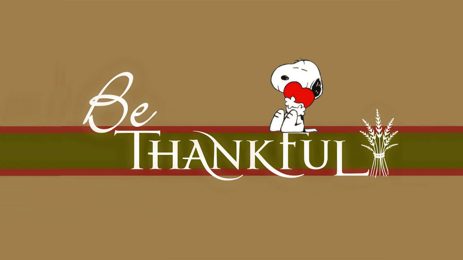 史努比拿著一顆紅心，旁邊有「Be THANKFUL」文字和小麥稈。
