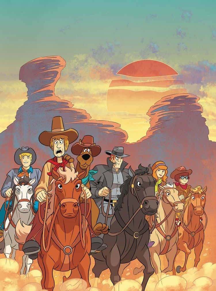Batman The Brave And The Bold 桌布 壁紙 — 史酷比幫騎馬穿過沙漠峽谷，夕陽西下，天空溫暖閃耀。