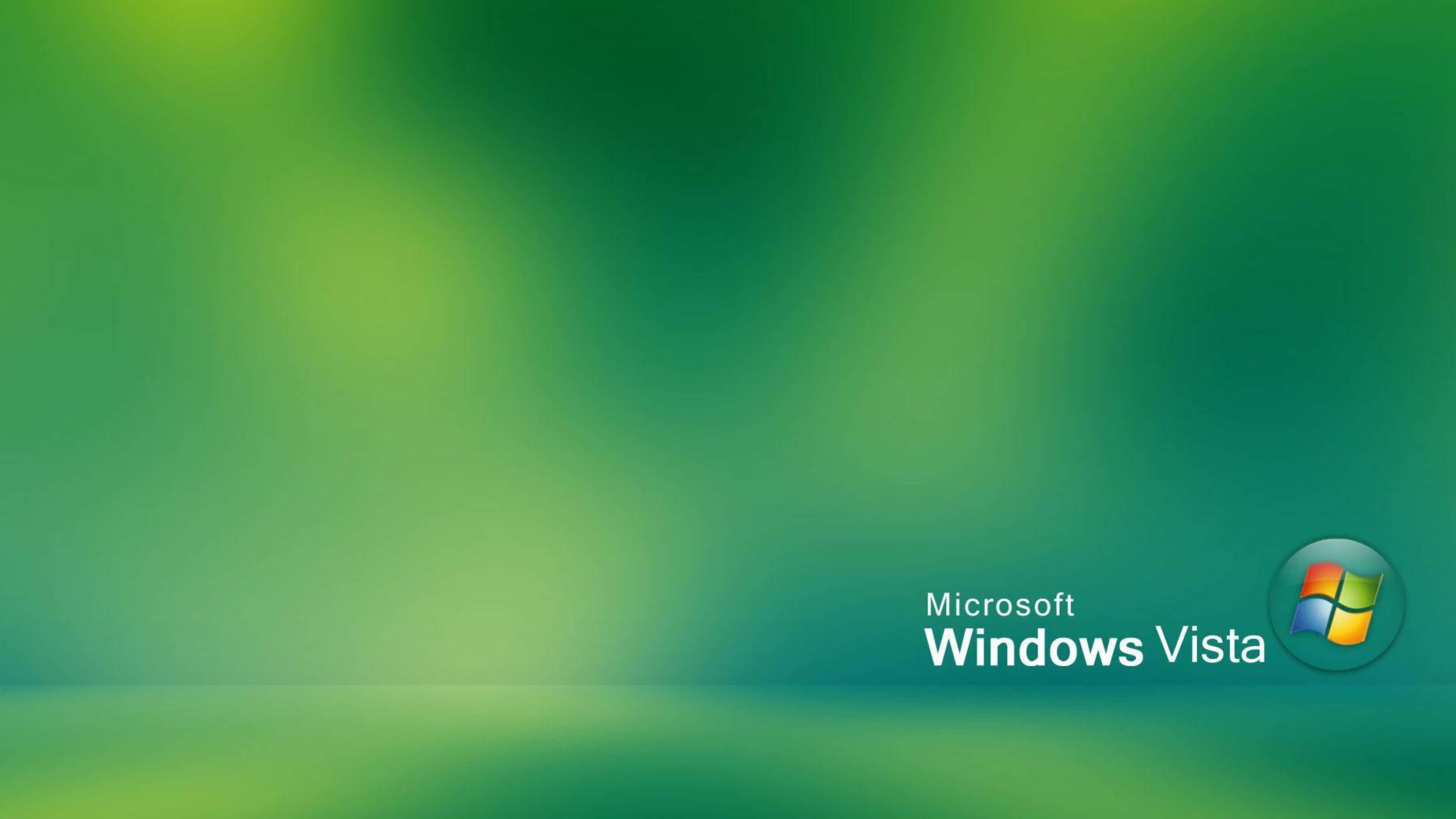 Windows Vista 桌布 壁紙 — 右下角帶有 Microsoft Windows Vista 標誌的柔和綠色漸變背景。