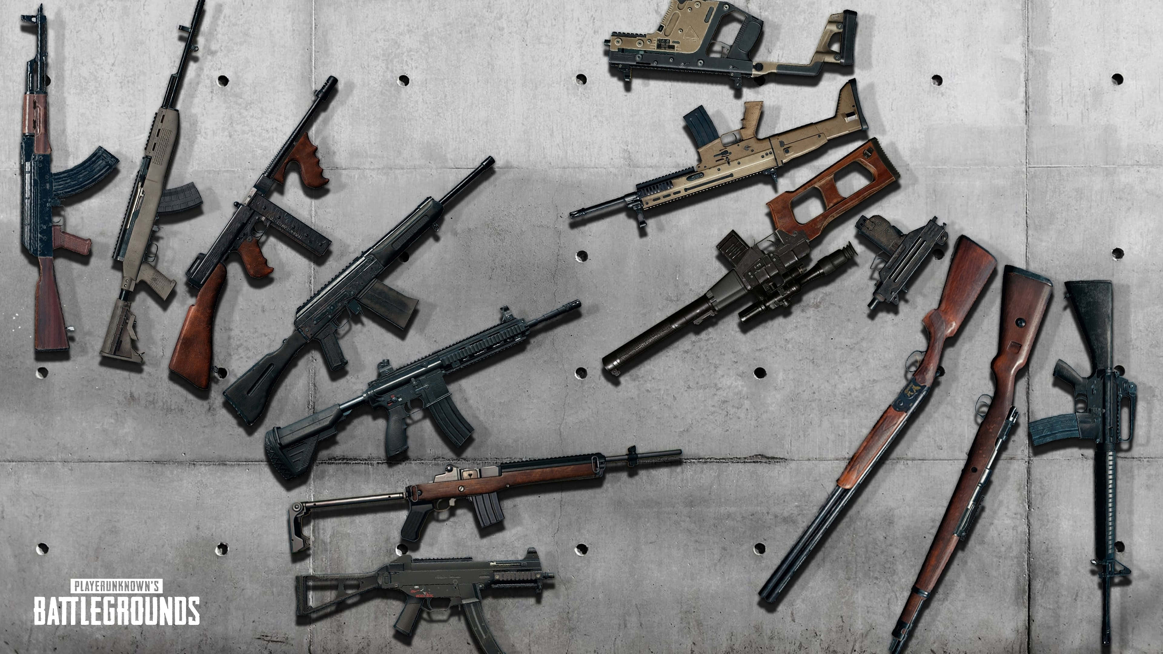 Pubg Guns 桌布 壁紙 — 各種槍械安裝在帶有紋理的混凝土牆上，可見螺栓孔和遊戲標誌。