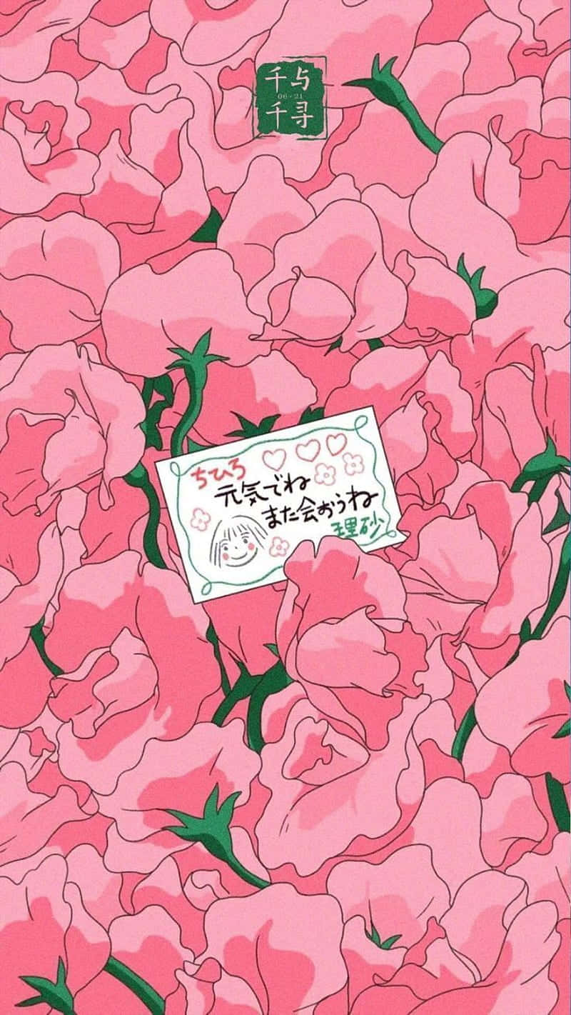 一張帶有日文字句和笑臉的便條，被粉紅色花朵環繞。
