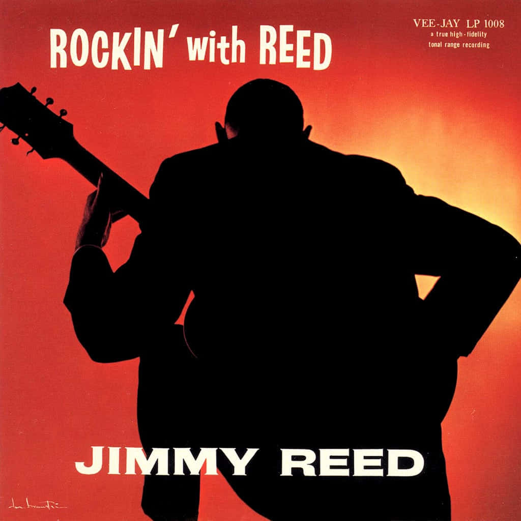 吉米·里德《Rockin' with Reed》乙烯唱片封面 壁紙 — 一個男人彈結他的剪影，背景是火紅和橙色的漸變天空。