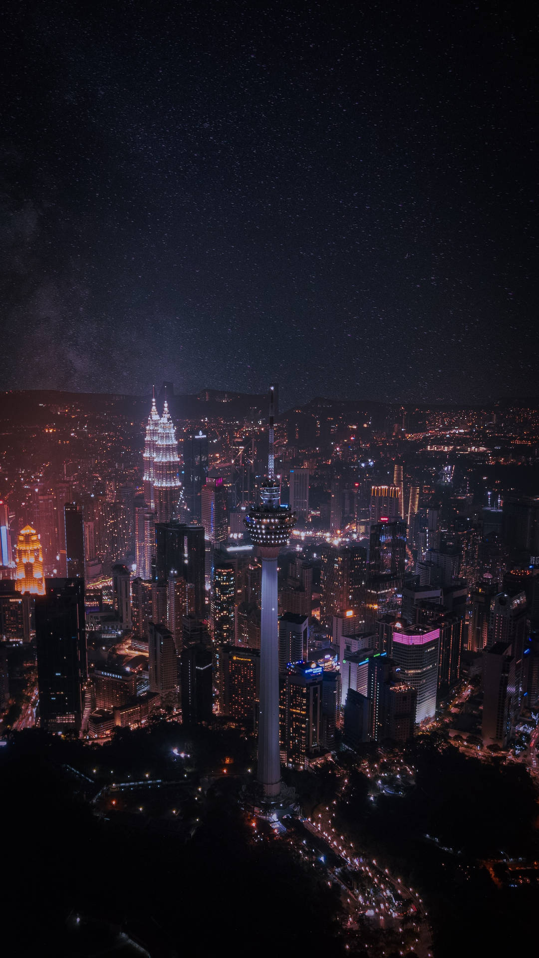 吉隆坡夜景，高樓大廈閃爍，星空燦爛。