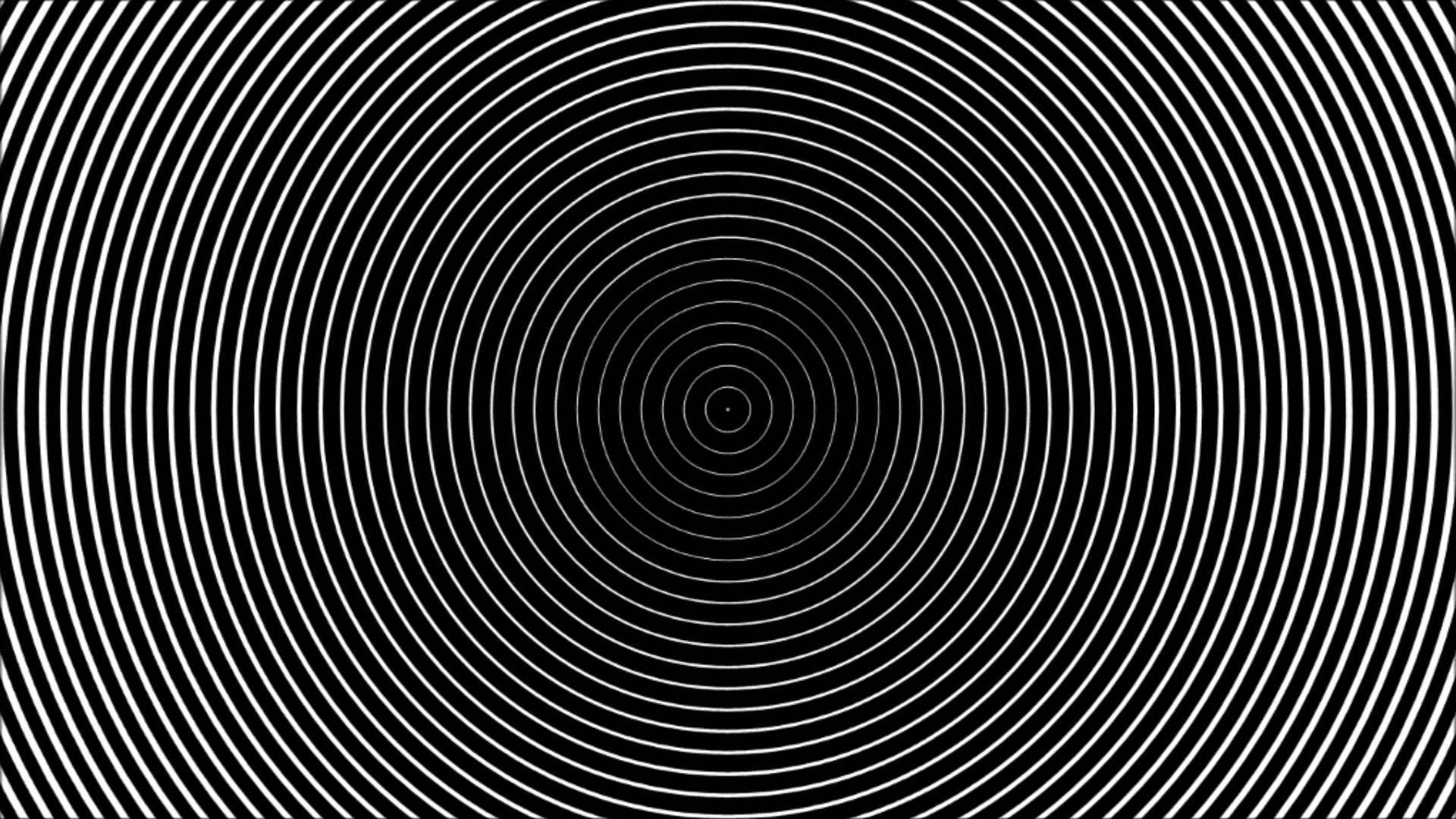 同心圓催眠圖案 壁紙 — 一個催眠般的圖案，由黑色背景上從中心點放射出的同心白色圓圈組成。