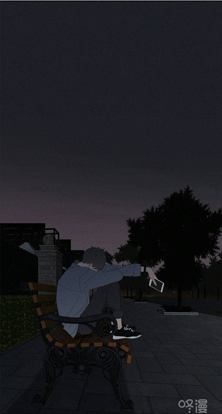 一個人在夜晚獨自坐在長椅上，手持電話。
