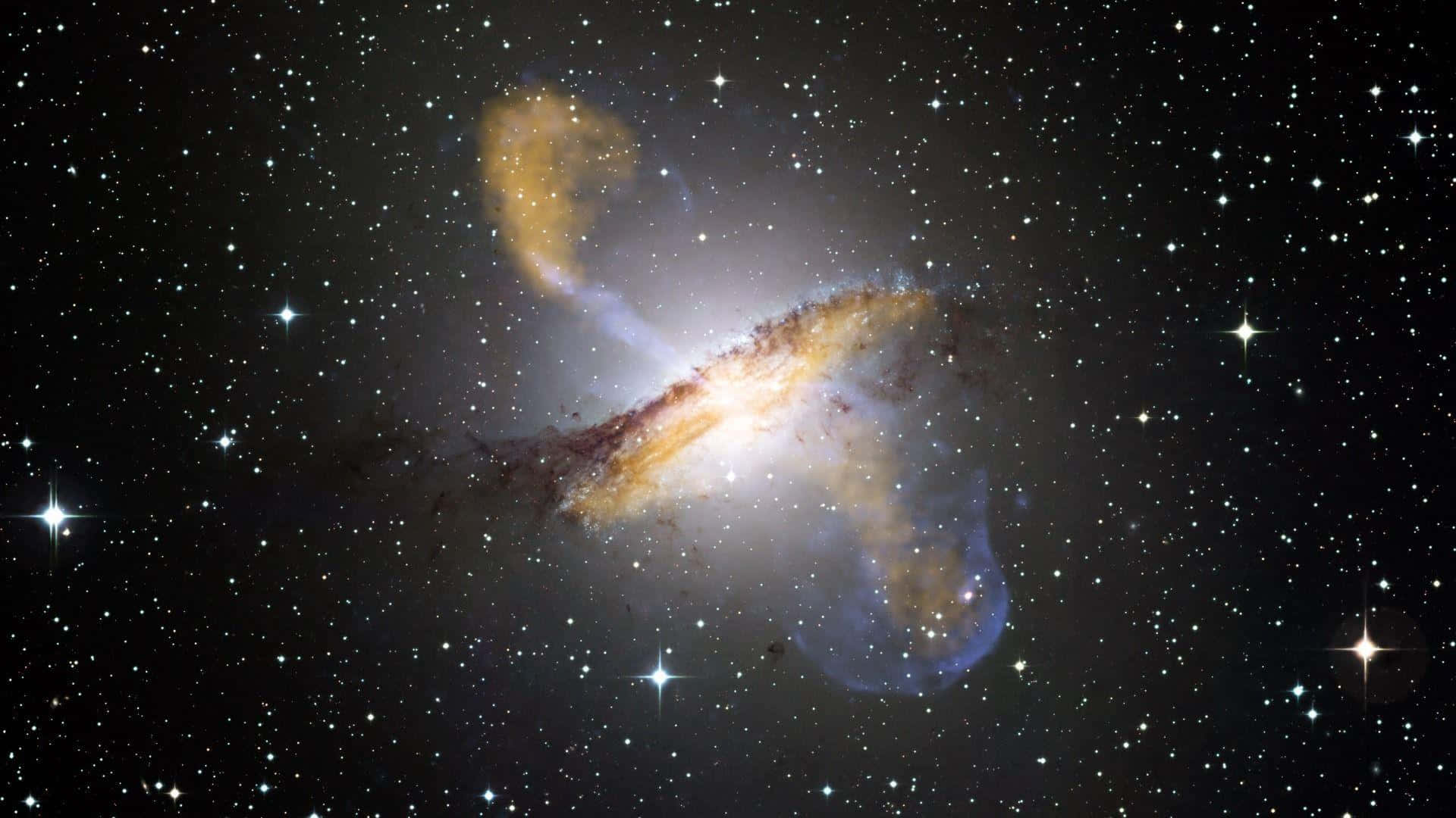 一個螺旋星系，金色旋臂和藍色星雲在星空背景下。
