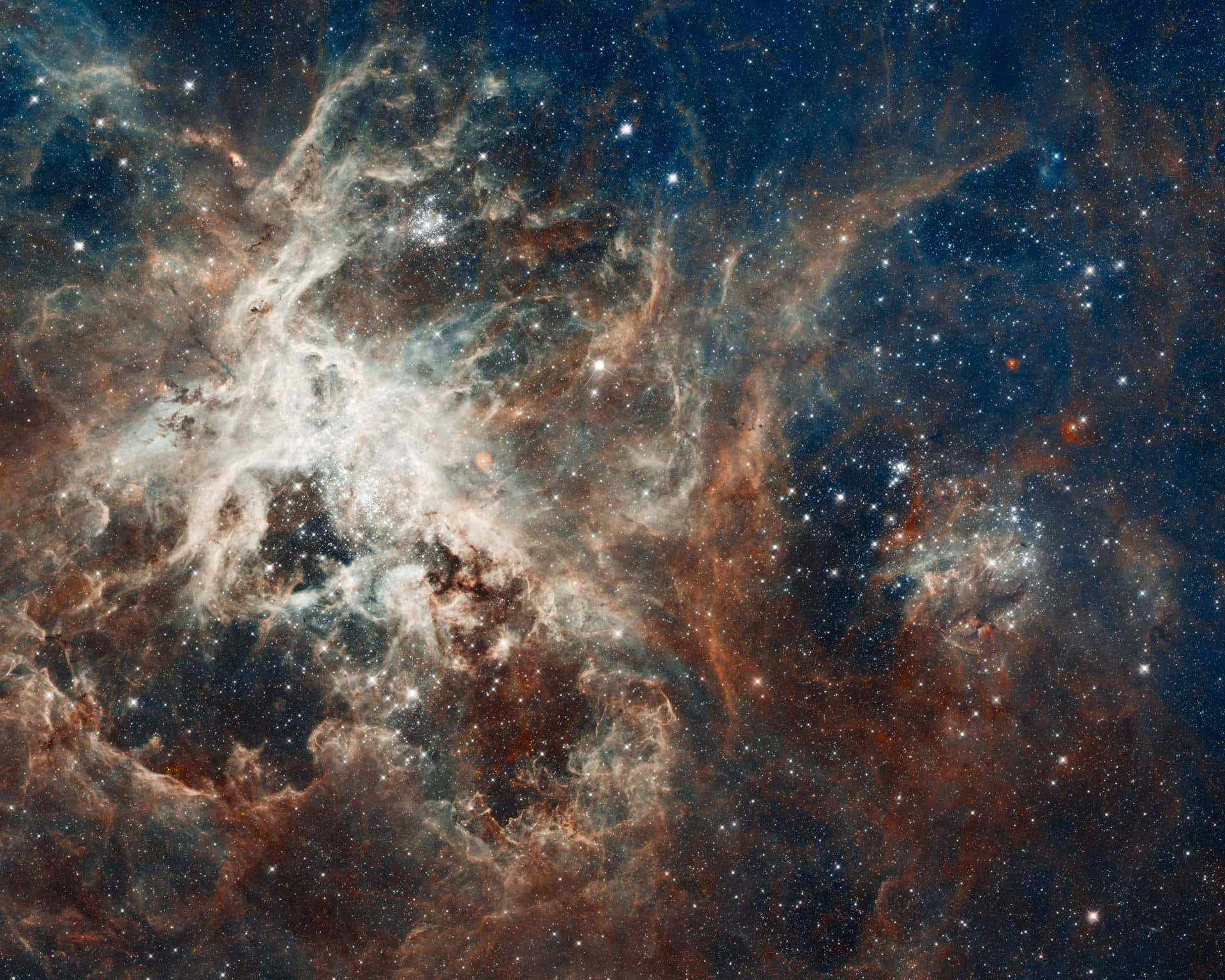 在深空中，發光的氣體雲和無數星辰組成的生動宇宙星雲。