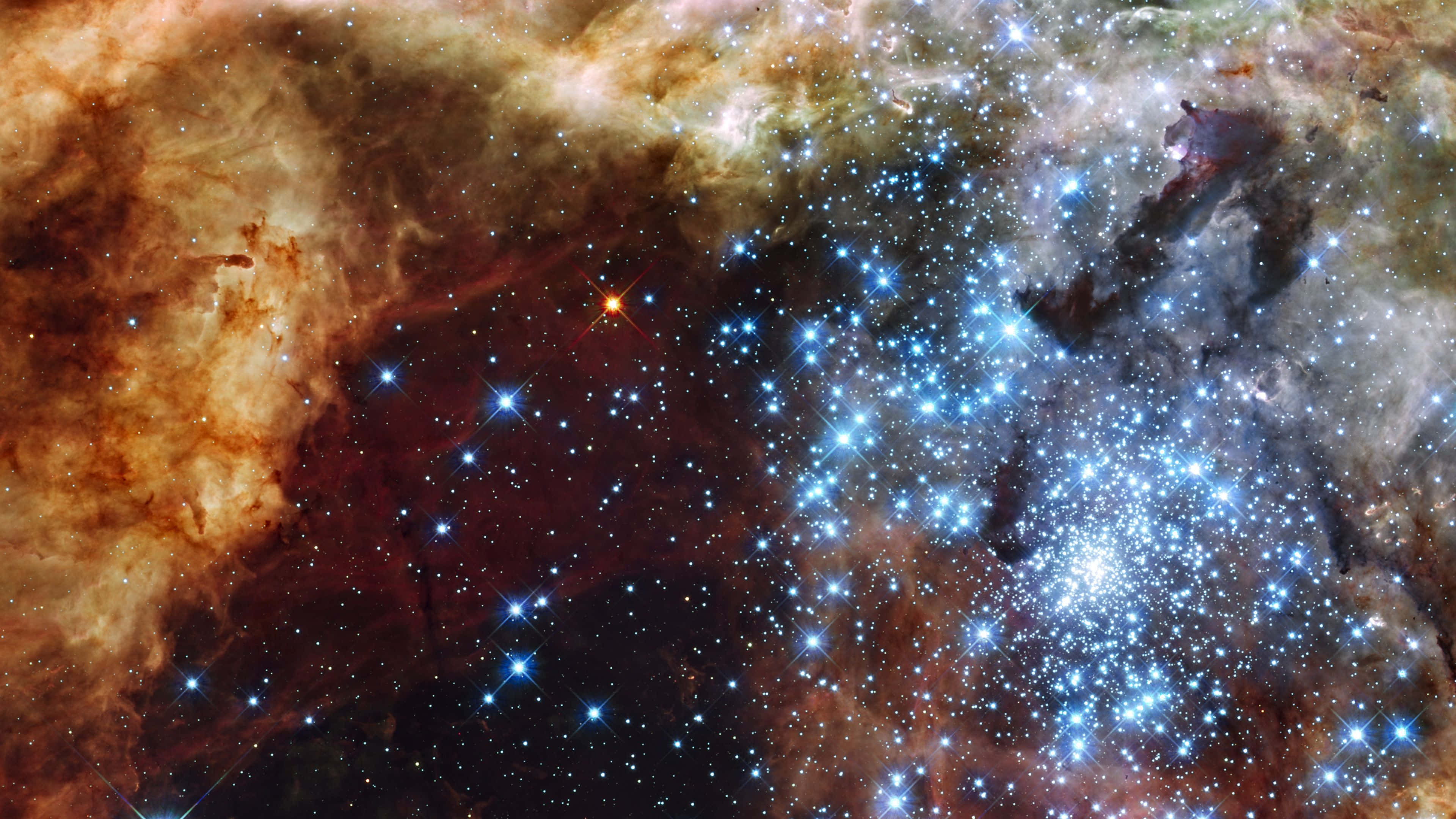 哈勃超深空場深空圖像 壁紙 — 一個充滿活力的宇宙星雲，由無數閃爍的星星照亮，橙色和藍色的氣體旋轉交織。