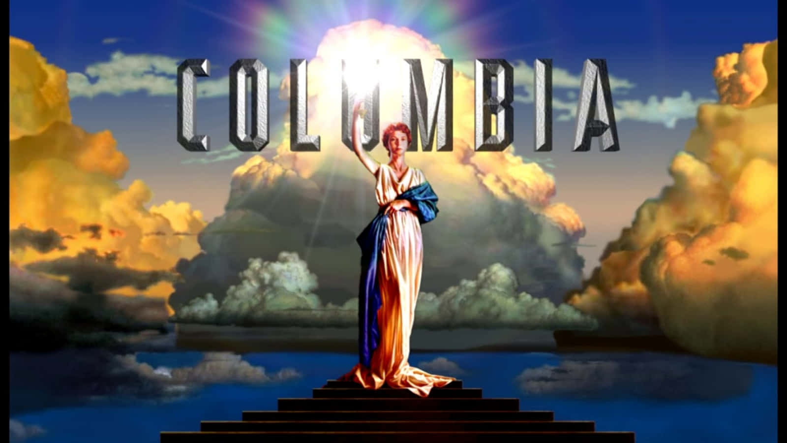 女神在台階上手持火炬，帶有「Columbia」標誌和戲劇性的天空
