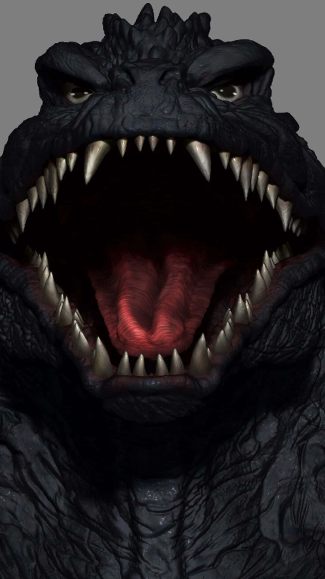 Godzilla 2000 桌布 壁紙 — 哥斯拉咆哮頭部的威脅性特寫，眼睛發光，牙齒鋒利，背景為灰色。