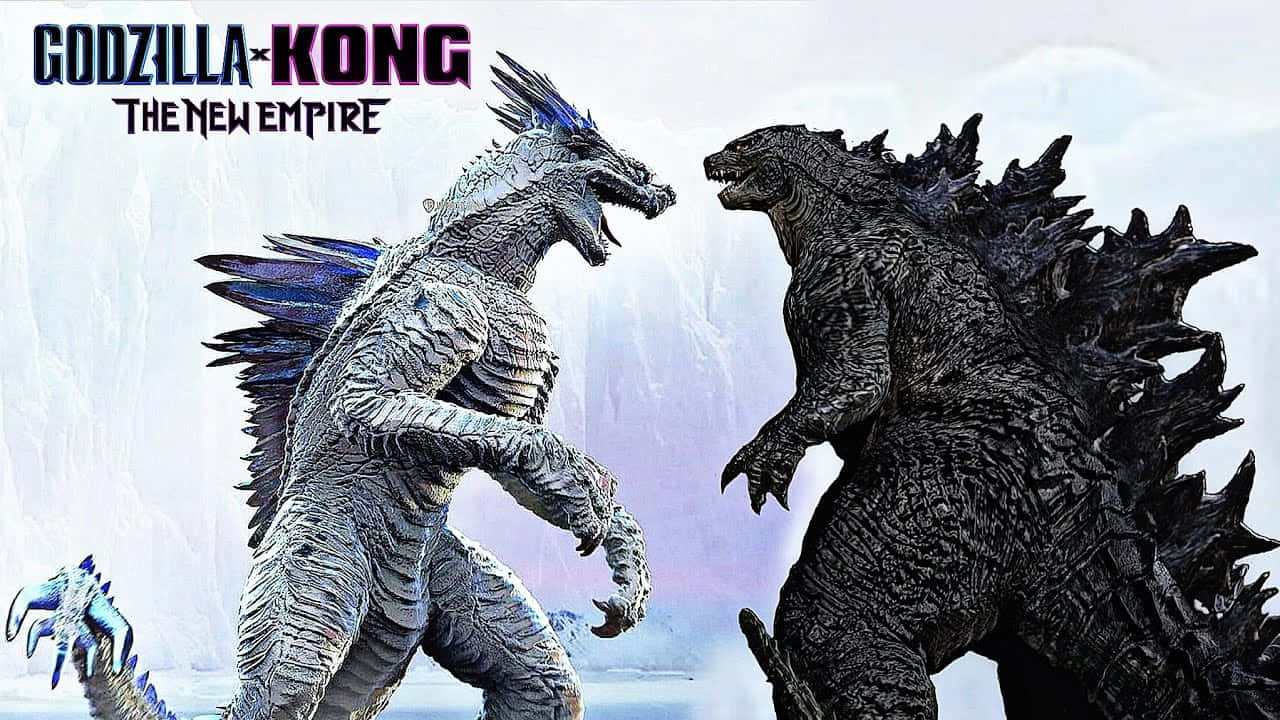 Godzilla X Kong The New Empire 桌布 壁紙 — 哥斯拉和金剛在戲劇性的冰雪景觀中對峙，有積雪覆蓋的懸崖和哥斯拉翅膀上發光的藍色點綴。