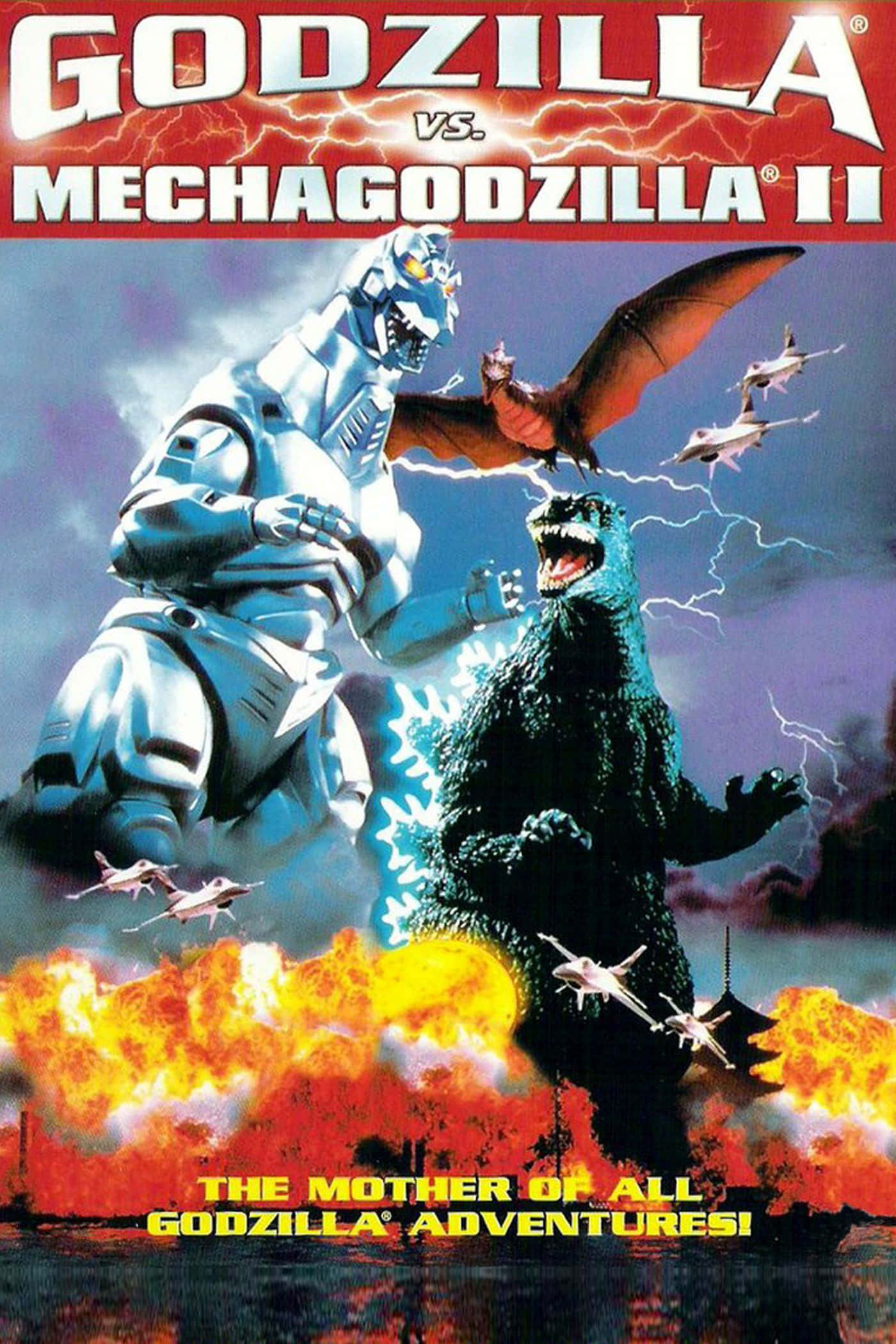 Godzilla Vs Mechagodzilla 桌布 壁紙 — 哥斯拉在燃燒的城市景觀上空與機械哥斯拉II戰鬥，伴隨著熾熱的爆炸和閃電，還有戰鬥機。