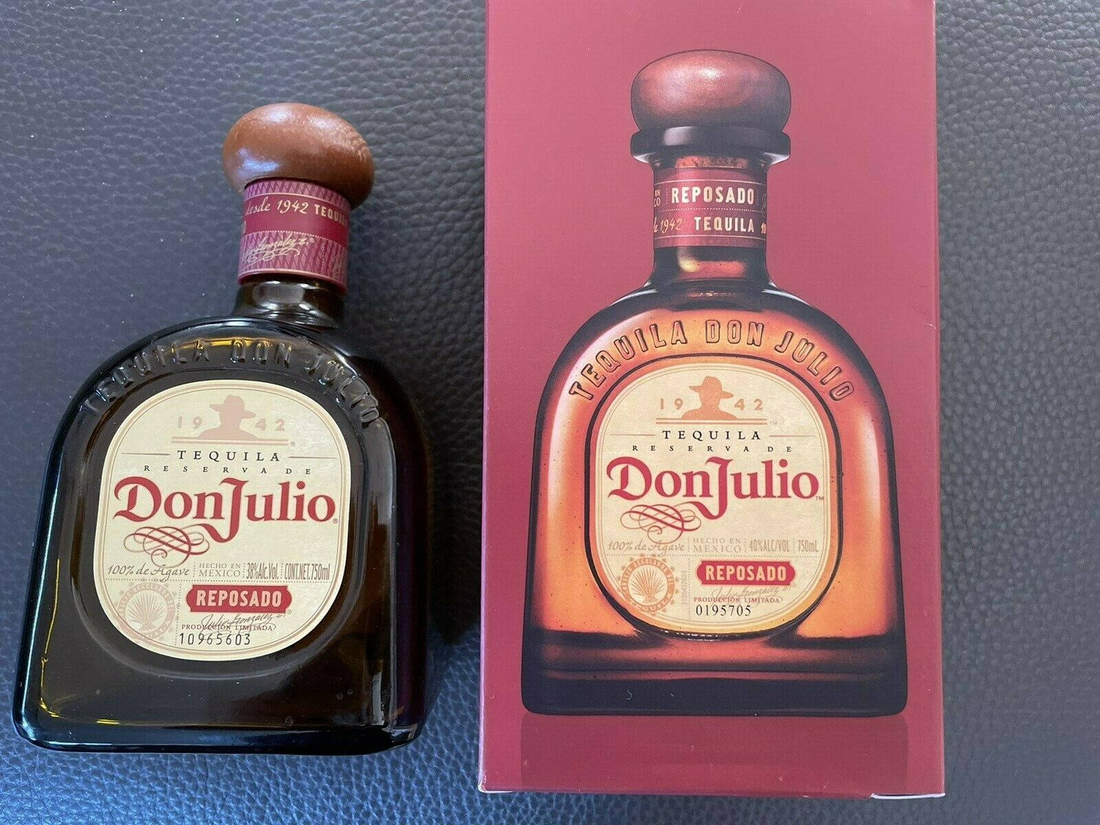 Don Julio Reposado 龍舌蘭酒瓶和盒子在深色紋理表面上