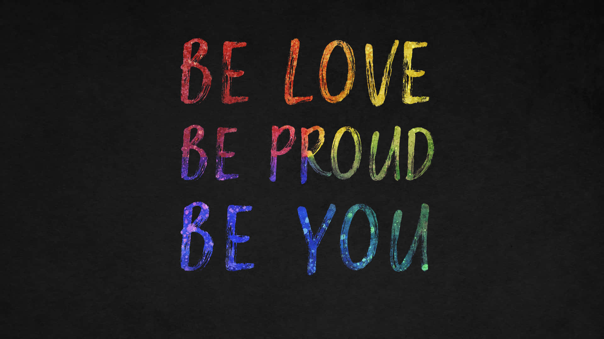 深色背景上寫有be love be proud be you的彩虹文字