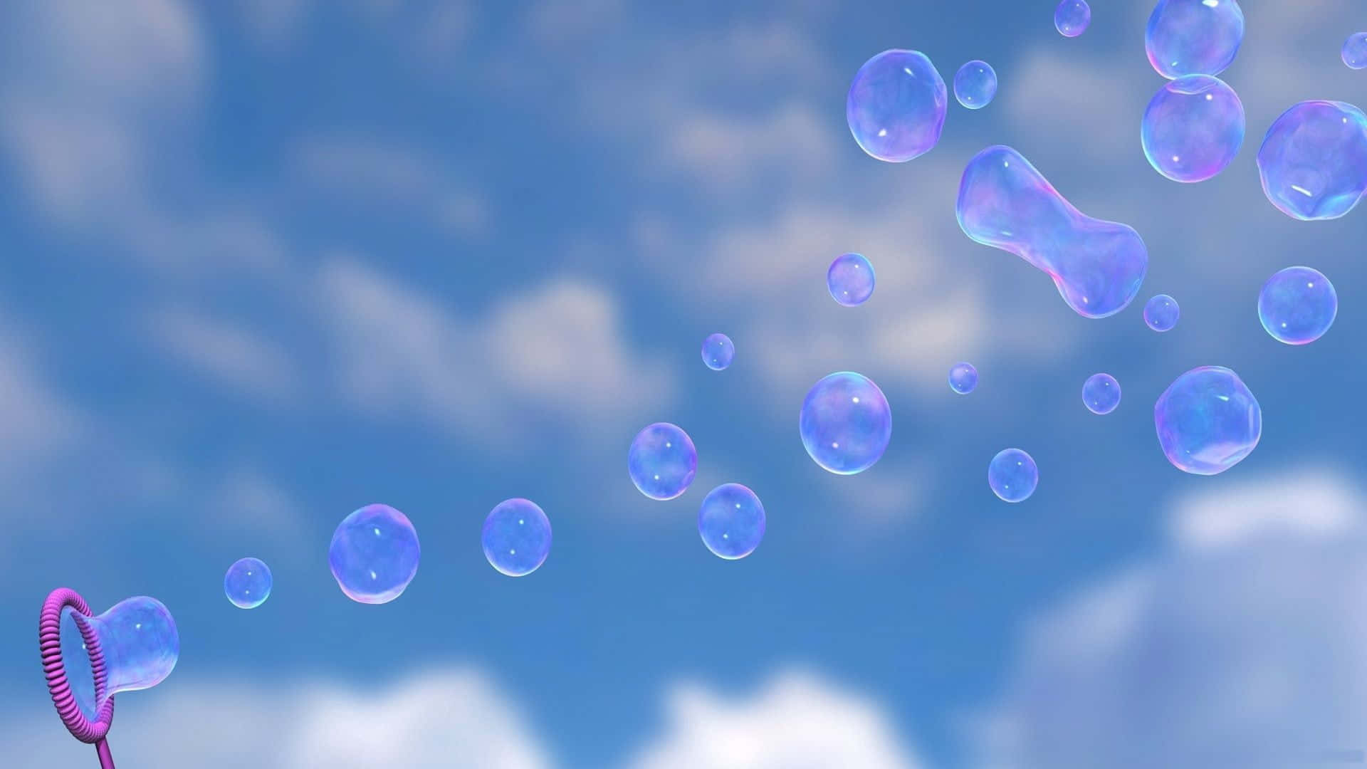 一支粉紅色泡泡棒向明亮的藍天吹出一串發光的泡泡。