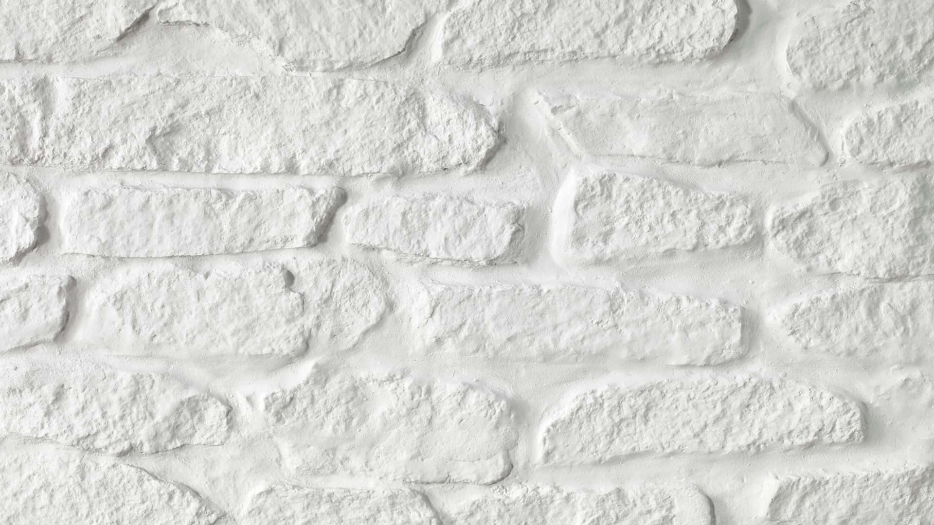 白色石磚牆，表面有紋理和柔和陰影。