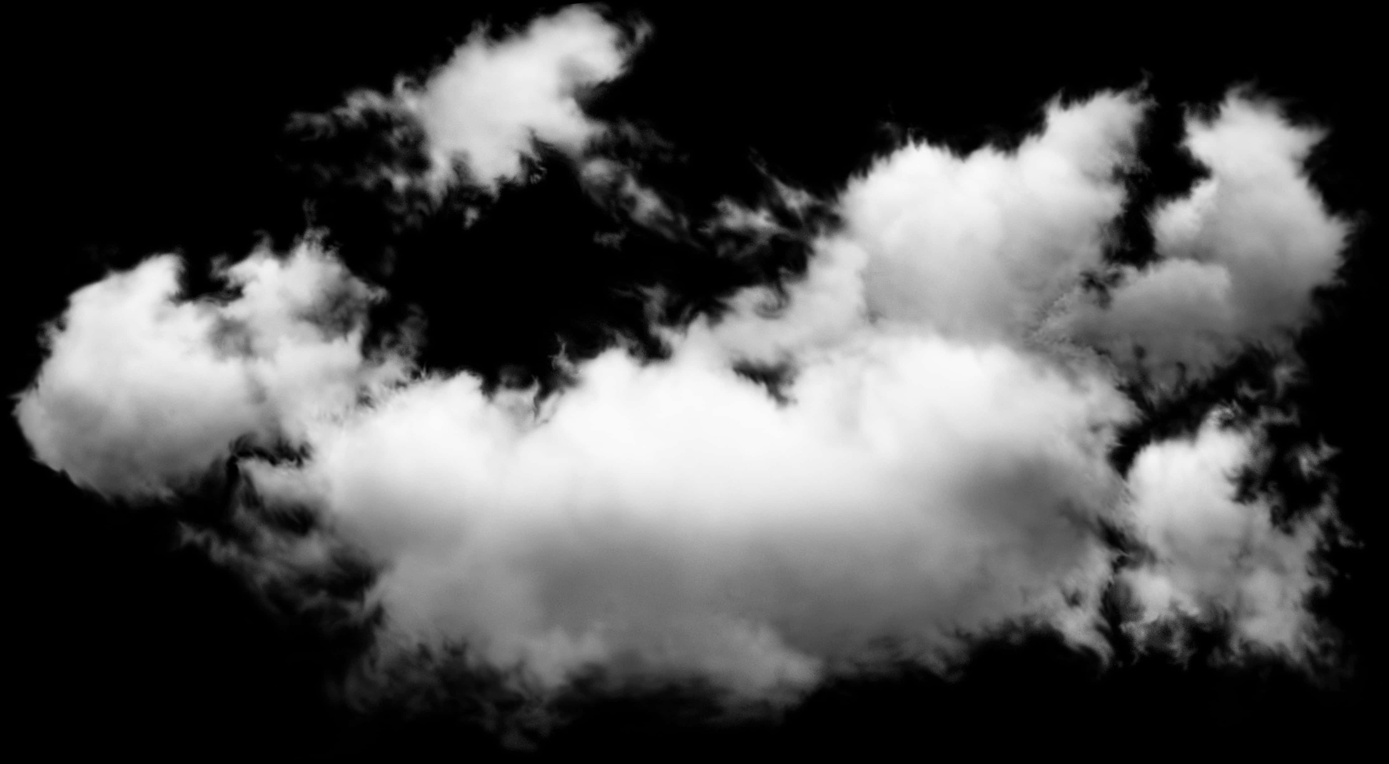 單色雲層構圖 壁紙 — 戲劇性的白色雲朵在純黑色背景上以高對比單色旋轉。